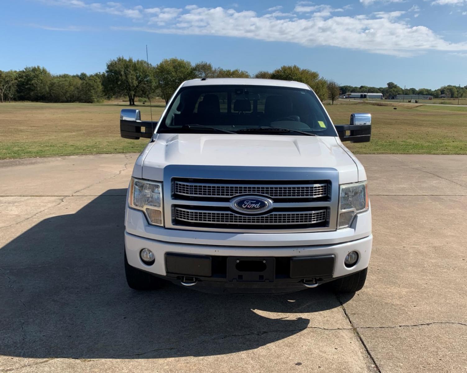 2012 White Ford F-150 XLT PLATINUM SUPER CREW 5.5-FT. BED 4WD (1FTFW1E66CF) with an 6.2L V8 SOHC 16V engine, 6-Speed Automatic transmission, located at 17760 Hwy 62, Morris, OK, 74445, (918) 733-4887, 35.609104, -95.877060 - 2012 FORD F-150 XLT PLATINUM 6.2L V8 4X4. THIS TRUCK RUNS ON GASOLINE AND FEATURES REMOTE KEYLESS ENTRY, REMOTE LOCKING SYSTEM, POWER LOCKS, POWER WINDOWS, POWER MIRRORS, POWER SEATS, TILT WHEEL, MULTIFUNCTION STEERING WHEEL CONTROLS, AM/FM RADIO, CD PLAYER, BLUETOOTH, NAVIGATION, BACKUP CAMERA, LEA - Photo #2