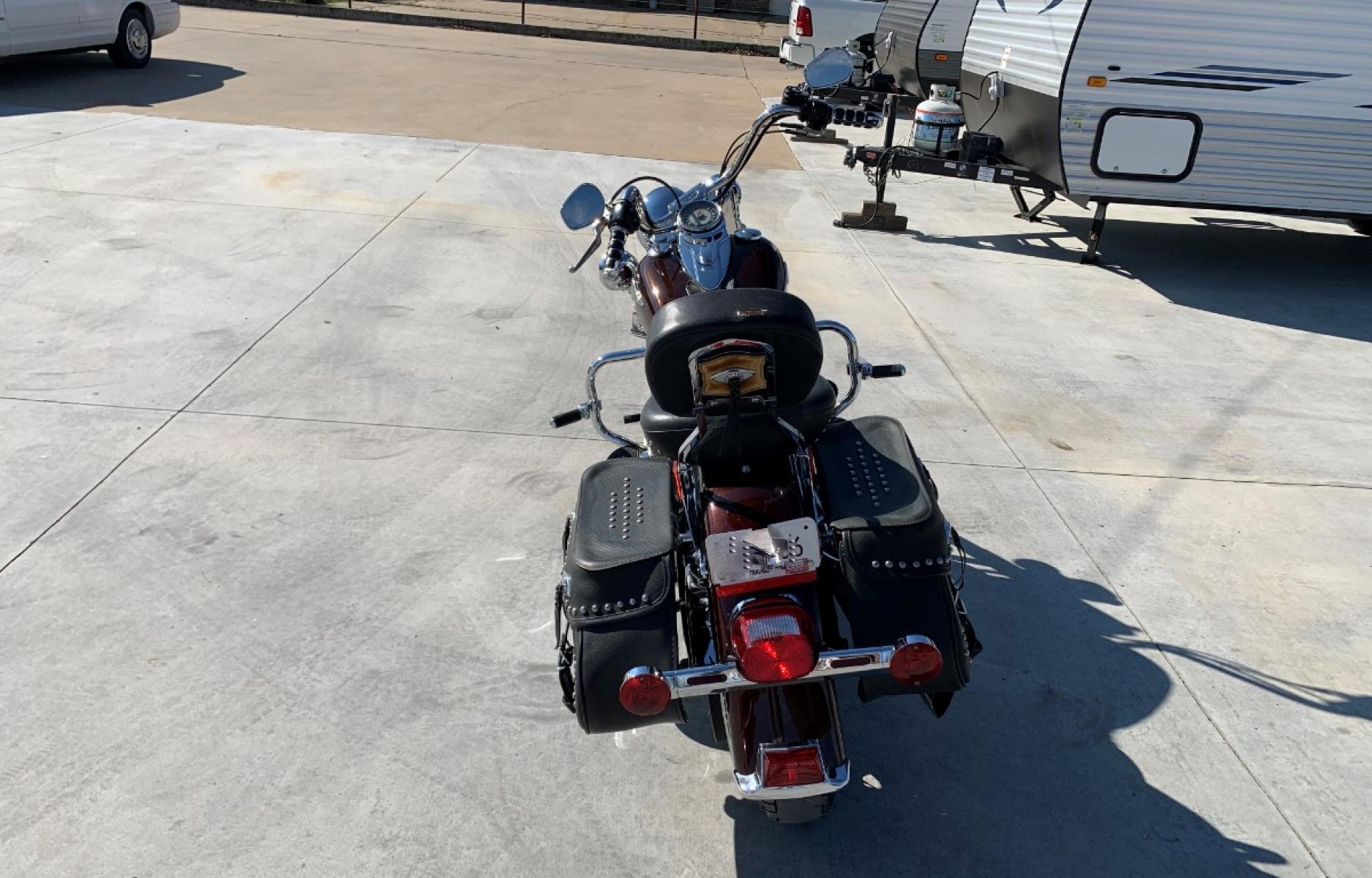 2009 PURPLE Harley-Davidson FLSTC - (1HD1BW5199Y) , located at 17760 HWY 62, MORRIS, 74445, 35.609104, -95.877060 - 2009 HARLEY- DAVIDSON FLSTC HERITAGE SOFTAIL 1584CC FEATURES CRUISE CONTROL, CHROME PASSING LAMPS, CHROME STAGGERED SHORTY EXHAUST WITH DUAL MUFFLERS, STUDDED LEATHER SADDLEBAGS, AND A FULL WINDSHIELD. A SMOOTH RIDE FOR LONG-RANGE TOURING COMFORT. IT RUNS GREAT !! ONLY 14,596 MILES. ** REBUILT TITLE - Photo #7