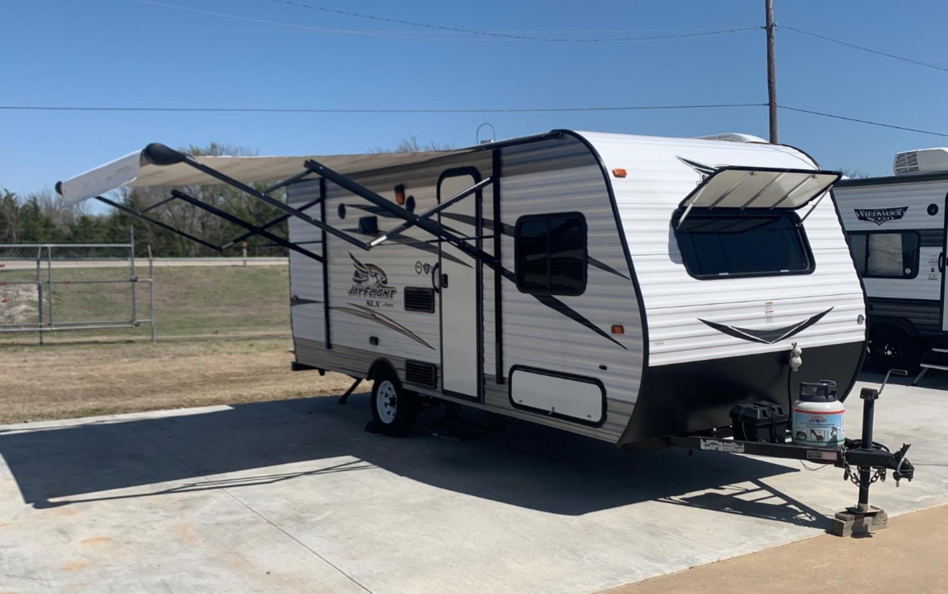 2016 TAN JAYCO Unknown 174BH (1UJBJ0AJ9G1) , located at 17760 Hwy 62, Morris, OK, 74445, 35.609104, -95.877060 - 2016 JAYCO JAY FLIGHT SLX 174BH IS 21.5FT LONG. THE OUTSIDE FEATURES A 10FT POWER AWNING, OUTSIDE STORAGE, OUTSIDE SPEAKERS, SINGLE AXLE, REAR MANUAL LEVELING JACKS, AND SPARE TIRE. AS YOU ENTER THE CAMPER, YOU WILL NOTICE THAT THERE ARE 5 WINDOWS SO YOU CAN LET NATURAL SUNLIGHT IN, THE QUEEN BE - Photo #0