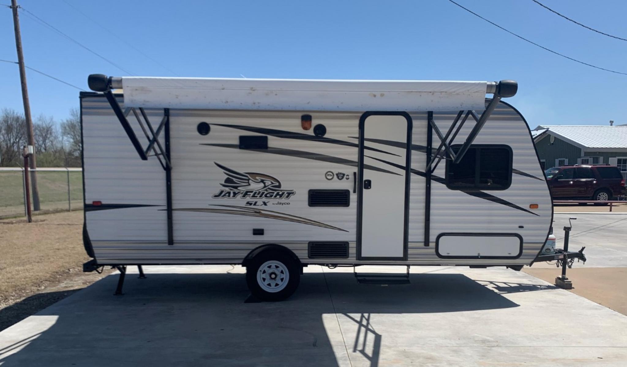 2016 TAN JAYCO Unknown 174BH (1UJBJ0AJ9G1) , located at 17760 Hwy 62, Morris, OK, 74445, 35.609104, -95.877060 - 2016 JAYCO JAY FLIGHT SLX 174BH IS 21.5FT LONG. THE OUTSIDE FEATURES A 10FT POWER AWNING, OUTSIDE STORAGE, OUTSIDE SPEAKERS, SINGLE AXLE, REAR MANUAL LEVELING JACKS, AND SPARE TIRE. AS YOU ENTER THE CAMPER, YOU WILL NOTICE THAT THERE ARE 5 WINDOWS SO YOU CAN LET NATURAL SUNLIGHT IN, THE QUEEN BE - Photo #1