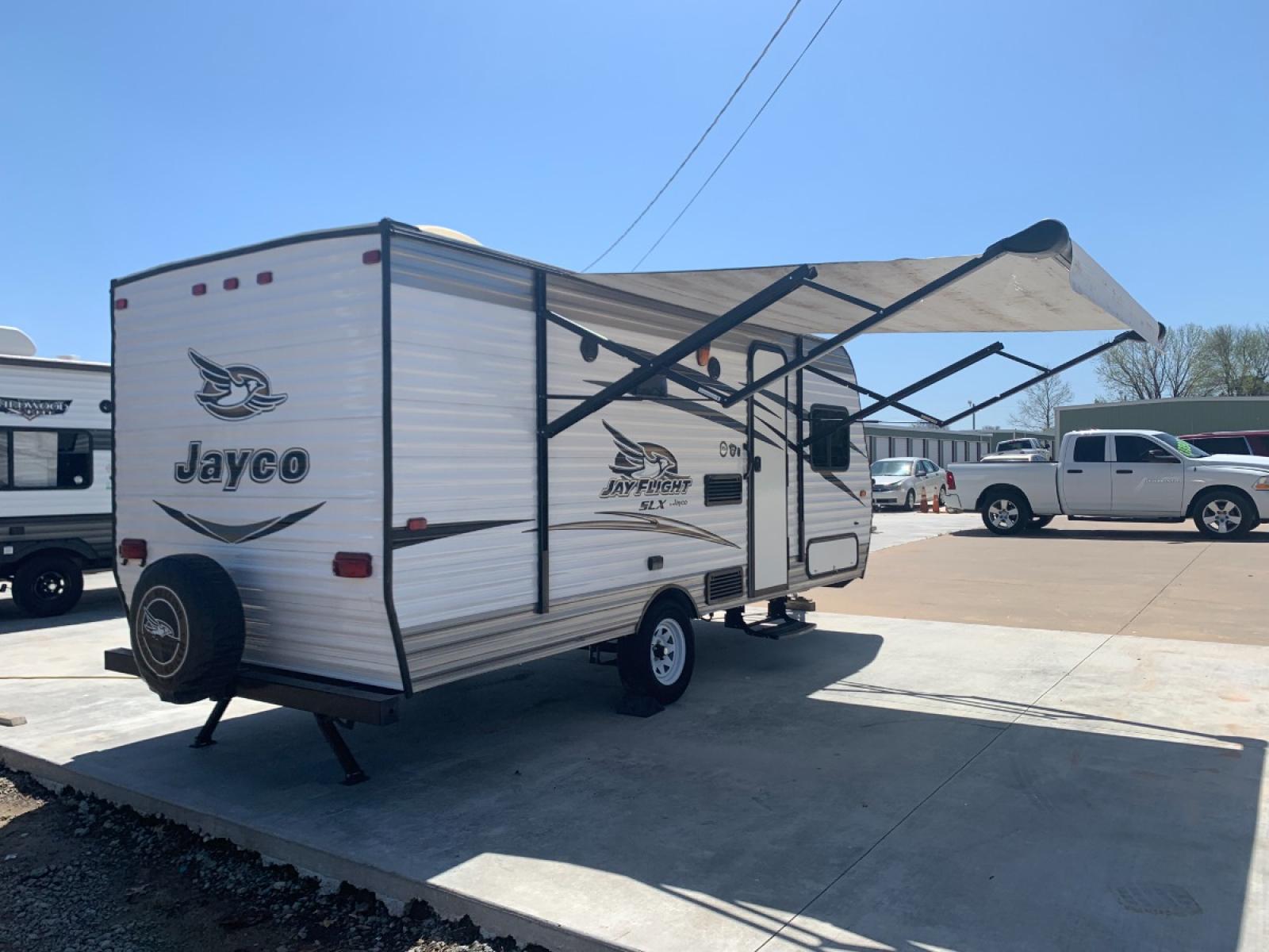 2016 TAN JAYCO Unknown 174BH (1UJBJ0AJ9G1) , located at 17760 Hwy 62, Morris, OK, 74445, 35.609104, -95.877060 - 2016 JAYCO JAY FLIGHT SLX 174BH IS 21.5FT LONG. THE OUTSIDE FEATURES A 10FT POWER AWNING, OUTSIDE STORAGE, OUTSIDE SPEAKERS, SINGLE AXLE, REAR MANUAL LEVELING JACKS, AND SPARE TIRE. AS YOU ENTER THE CAMPER, YOU WILL NOTICE THAT THERE ARE 5 WINDOWS SO YOU CAN LET NATURAL SUNLIGHT IN, THE QUEEN BE - Photo #2