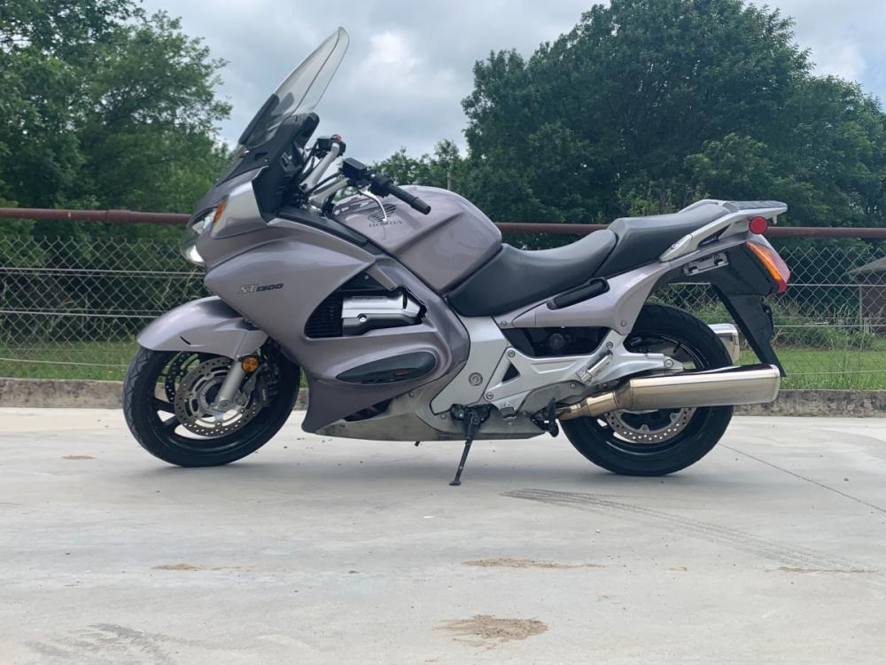 2003 Silver Honda ST1300 ST1300 (JH2SC51103M) with an 1261CC engine, 5 SPEED transmission, located at 17760 HWY 62, MORRIS, 74445, 35.609104, -95.877060 - 2003 HONDA ST1300 IS A 1261CC 5-SPEED TRANSMISSION WITH AN ELECTRIC START, POWER-ADJUSTABLE LIGHTS, POWER-ADJUSTABLE WINDSHIELD, NICE CLEAN TOURING SPORTS BIKE. ONLY 17,093 MILES, MARATHON TIRES, DOES HAVE REBUILT TITLE DUE TO A SMALL ACCIDENT. LIGHT SCRAPES AS SHOWN IN PICTURES. $3,900 CALL R - Photo #1