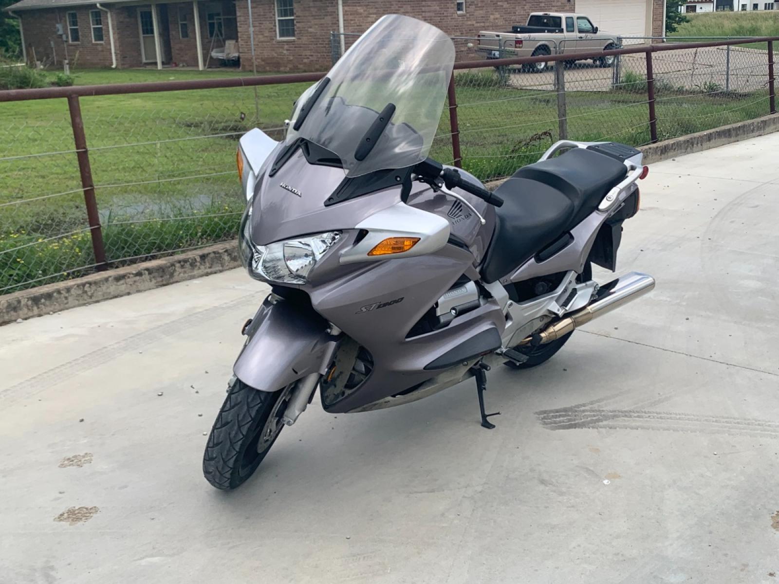 2003 Silver Honda ST1300 ST1300 (JH2SC51103M) with an 1261CC engine, 5 SPEED transmission, located at 17760 HWY 62, MORRIS, 74445, 35.609104, -95.877060 - 2003 HONDA ST1300 1261CC 5-SPEED TRANSMISSION WITH AN ELECTRIC START, POWER-ADJUSTABLE LIGHTS, POWER-ADJUSTABLE WINDSHIELD, NICE CLEAN TOURING SPORTS BIKE. ONLY 17,093 MILES, MARATHON TIRES, IT HAS REBUILT TITLE DUE TO A SMALL ACCIDENT. LIGHT SCRAPES AS SHOWN IN PICTURES. WE OFFER A FREE CARFAX ON - Photo #2