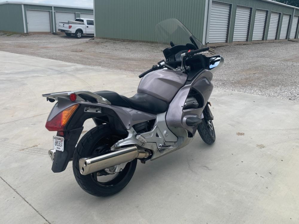 2003 Silver Honda ST1300 ST1300 (JH2SC51103M) with an 1261CC engine, 5 SPEED transmission, located at 17760 HWY 62, MORRIS, 74445, 35.609104, -95.877060 - 2003 HONDA ST1300 IS A 1261CC 5-SPEED TRANSMISSION WITH AN ELECTRIC START, POWER-ADJUSTABLE LIGHTS, POWER-ADJUSTABLE WINDSHIELD, NICE CLEAN TOURING SPORTS BIKE. ONLY 17,093 MILES, MARATHON TIRES, DOES HAVE REBUILT TITLE DUE TO A SMALL ACCIDENT. LIGHT SCRAPES AS SHOWN IN PICTURES. $3,900 CALL R - Photo #4