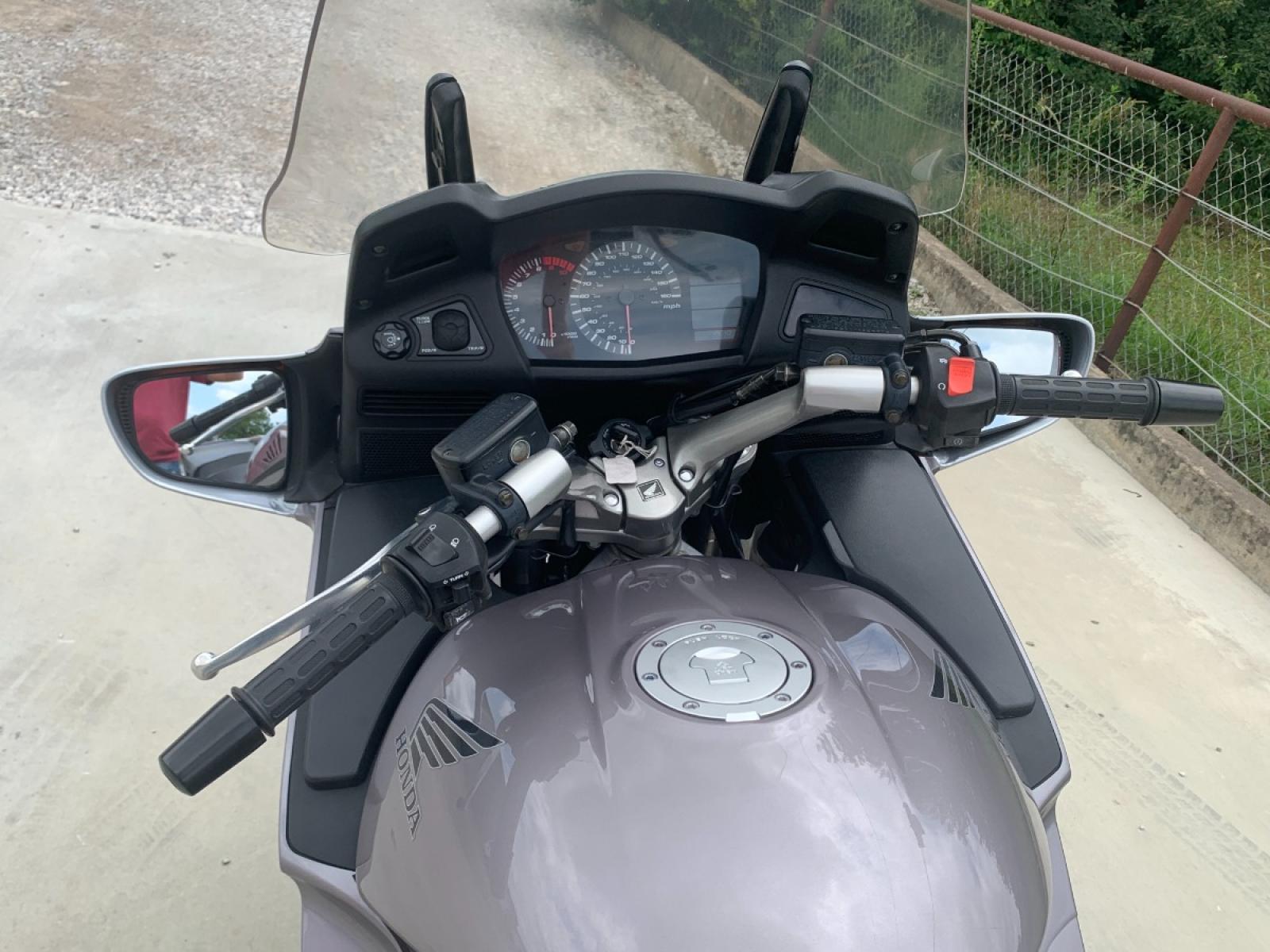 2003 Silver Honda ST1300 ST1300 (JH2SC51103M) with an 1261CC engine, 5 SPEED transmission, located at 17760 HWY 62, MORRIS, 74445, 35.609104, -95.877060 - 2003 HONDA ST1300 1261CC 5-SPEED TRANSMISSION WITH AN ELECTRIC START, POWER-ADJUSTABLE LIGHTS, POWER-ADJUSTABLE WINDSHIELD, NICE CLEAN TOURING SPORTS BIKE. ONLY 17,093 MILES, MARATHON TIRES, IT HAS REBUILT TITLE DUE TO A SMALL ACCIDENT. LIGHT SCRAPES AS SHOWN IN PICTURES. WE OFFER A FREE CARFAX ON - Photo #7