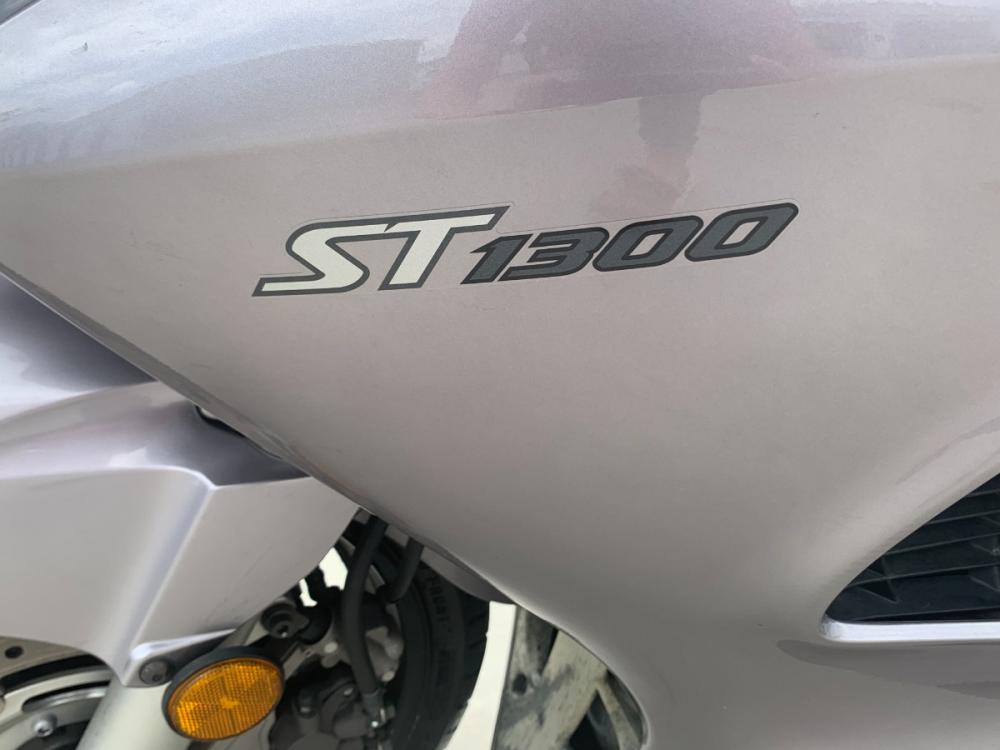 2003 Silver Honda ST1300 ST1300 (JH2SC51103M) with an 1261CC engine, 5 SPEED transmission, located at 17760 HWY 62, MORRIS, 74445, 35.609104, -95.877060 - 2003 HONDA ST1300 IS A 1261CC 5-SPEED TRANSMISSION WITH AN ELECTRIC START, POWER-ADJUSTABLE LIGHTS, POWER-ADJUSTABLE WINDSHIELD, NICE CLEAN TOURING SPORTS BIKE. ONLY 17,093 MILES, MARATHON TIRES, DOES HAVE REBUILT TITLE DUE TO A SMALL ACCIDENT. LIGHT SCRAPES AS SHOWN IN PICTURES. $3,900 CALL R - Photo #8