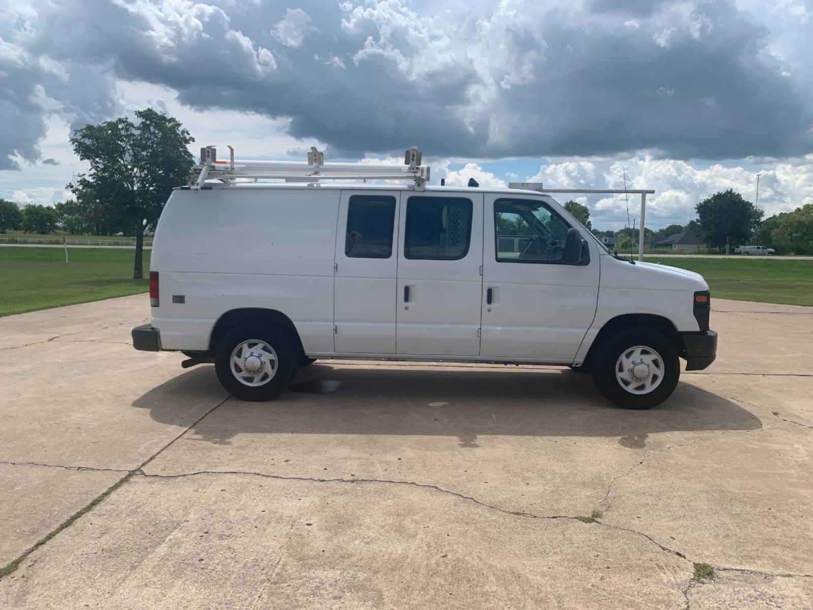 2011 White Ford E-Series Van E-250 (1FTNE2EL6BD) with an 5.4L V8 SOHC 16V engine, 4-Speed Automatic transmission, located at 17760 Hwy 62, Morris, OK, 74445, (918) 733-4887, 35.609104, -95.877060 - 2011 FORD E-SERIES VAN E-250 5.4 V8 DEDICATED CNG (COMPRESSED NATURAL GAS) DOES NOT RUN ON GASOLINE. THE FORD E-SERIES VAN FEATURES MANUAL SEATS, MANUAL LOCKS, MANUAL WINDOWS, MANUAL MIRRORS, FRONT HEAT AND AIR, AM/FM RADIO, LEATHER SEATS, STEEL SHELVES, SPLIT SWING-OUT RIGHT DOORS, AND PLENTY OF SP - Photo #4