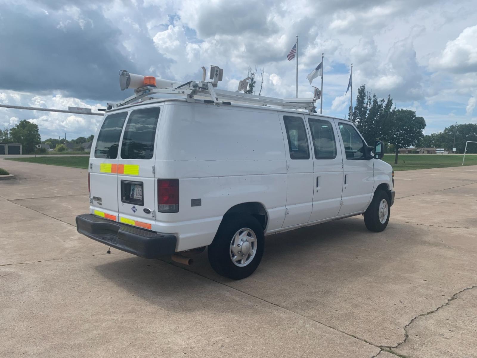 2011 White Ford E-Series Van E-250 (1FTNE2EL6BD) with an 5.4L V8 SOHC 16V engine, 4-Speed Automatic transmission, located at 17760 Hwy 62, Morris, OK, 74445, (918) 733-4887, 35.609104, -95.877060 - 2011 FORD E-SERIES VAN E-250 5.4 V8 DEDICATED CNG (COMPRESSED NATURAL GAS) DOES NOT RUN ON GASOLINE. THE FORD E-SERIES VAN FEATURES MANUAL SEATS, MANUAL LOCKS, MANUAL WINDOWS, MANUAL MIRRORS, FRONT HEAT AND AIR, AM/FM RADIO, LEATHER SEATS, STEEL SHELVES, SPLIT SWING-OUT RIGHT DOORS, AND PLENTY OF SP - Photo #5