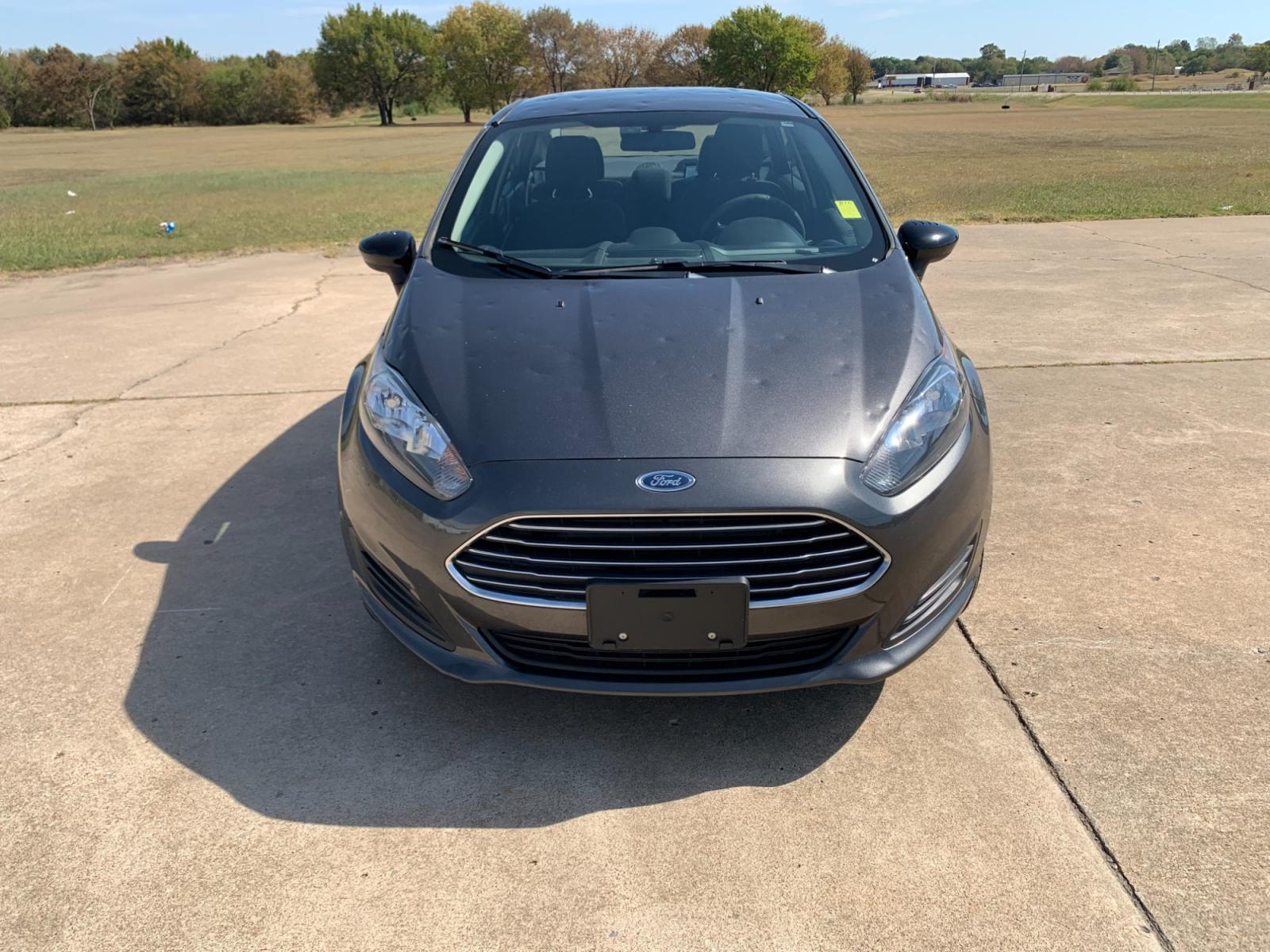 2017 GRAY Ford Fiesta SE Sedan (3FADP4BJXHM) with an 1.6L L4 DOHC 16V engine, located at 17760 Hwy 62, Morris, OK, 74445, (918) 733-4887, 35.609104, -95.877060 - Photo #1