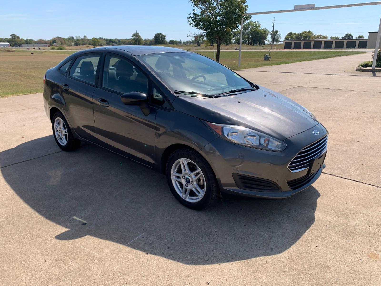 2017 GRAY Ford Fiesta SE Sedan (3FADP4BJXHM) with an 1.6L L4 DOHC 16V engine, located at 17760 Hwy 62, Morris, OK, 74445, (918) 733-4887, 35.609104, -95.877060 - Photo #2