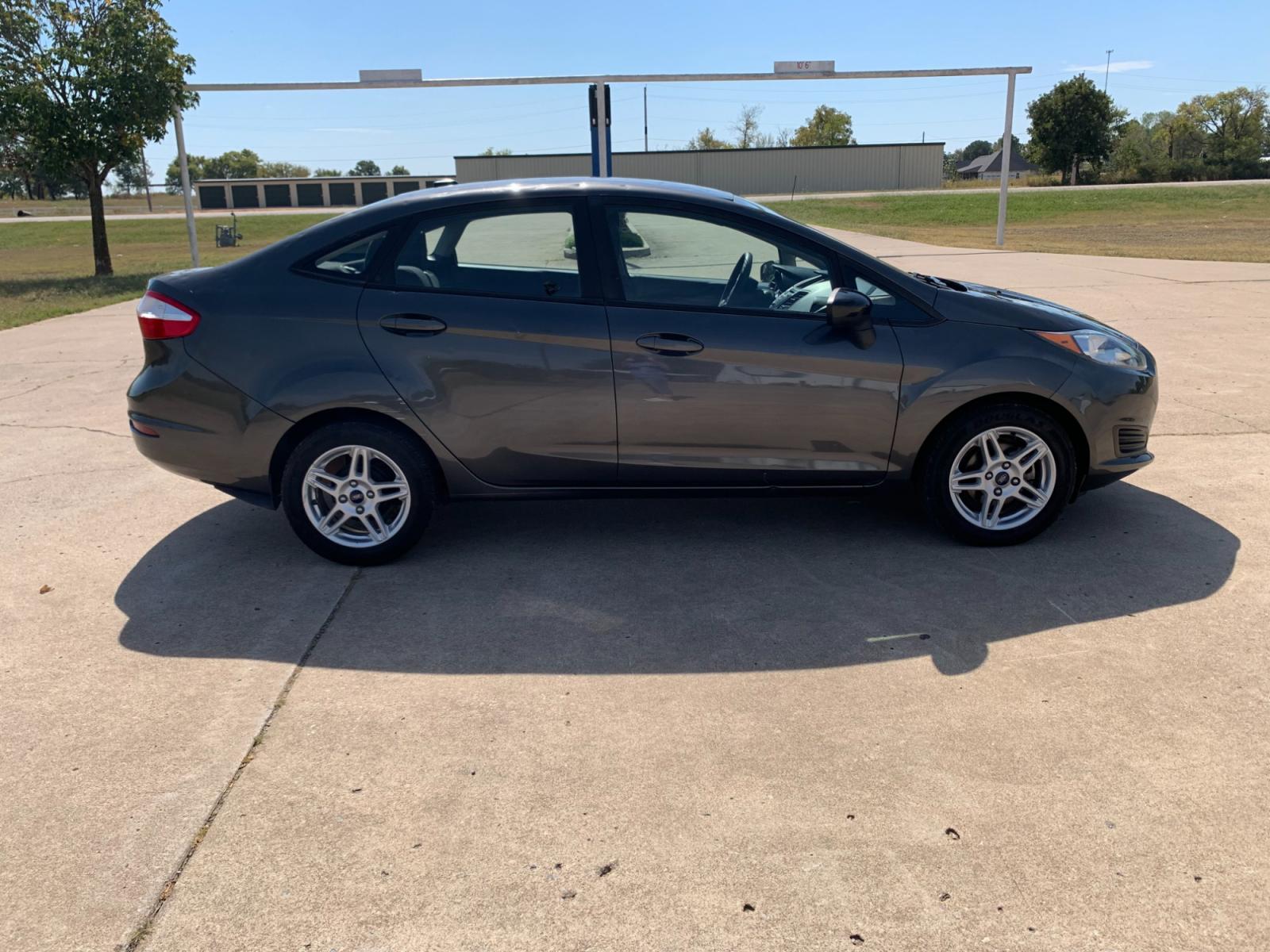 2017 GRAY Ford Fiesta SE Sedan (3FADP4BJXHM) with an 1.6L L4 DOHC 16V engine, located at 17760 Hwy 62, Morris, OK, 74445, (918) 733-4887, 35.609104, -95.877060 - Photo #3