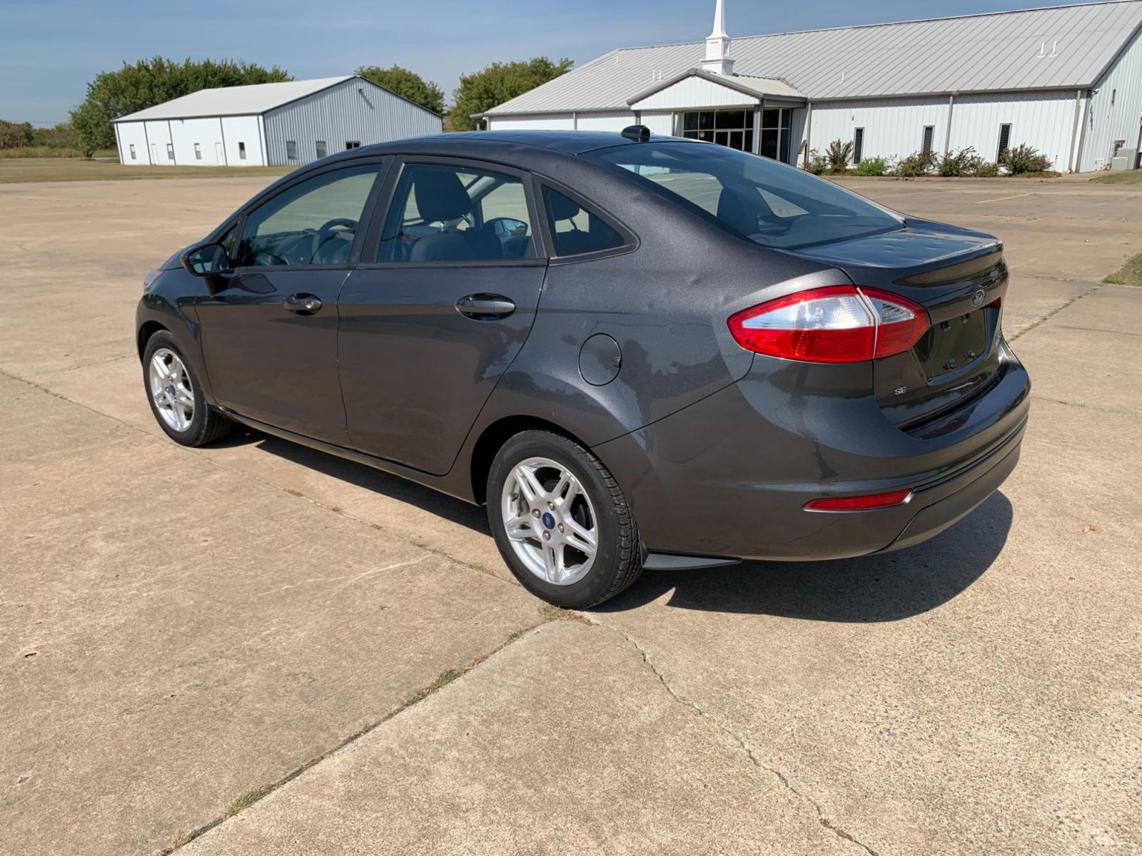 2017 GRAY Ford Fiesta SE Sedan (3FADP4BJXHM) with an 1.6L L4 DOHC 16V engine, located at 17760 Hwy 62, Morris, OK, 74445, (918) 733-4887, 35.609104, -95.877060 - Photo #6
