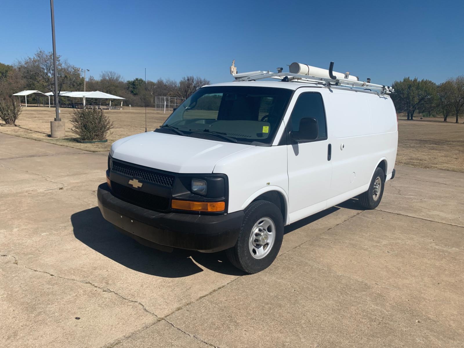 2013 White Chevrolet Express 2500 Cargo (1GCWGFCB9D1) with an 6.0L V8 OHV 16V FFV engine, 6-Speed Automatic transmission, located at 17760 Hwy 62, Morris, OK, 74445, (918) 733-4887, 35.609104, -95.877060 - 2013 CHEVROLET EXPRESS CARGO VAN 6.0L V8 RWD FEATURING POWER LOCKS, MANUAL WINDOWS, MANUAL MIRRORS, MANUAL SEATS, AM/FM STEREO, LEATHER SEATS, LEATHER-WRAPPED STEERING WHEEL, TACHOMETER, TRACTION CONTROL, LOCKING METAL CONSOLE, STEEL SHELVES, SPLIT SWING-OUT RIGHT DOORS, RUBBER MATS, LOAD-BEARING E - Photo #0