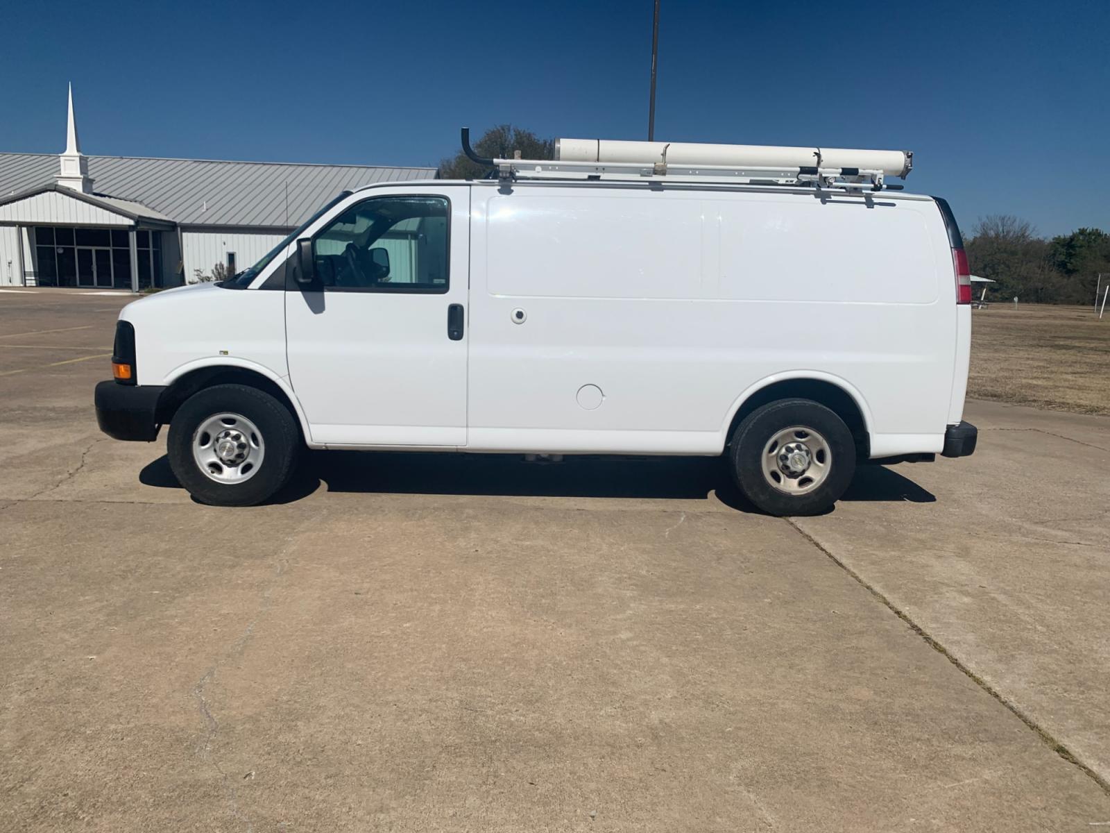 2013 White Chevrolet Express 2500 Cargo (1GCWGFCB9D1) with an 6.0L V8 OHV 16V FFV engine, 6-Speed Automatic transmission, located at 17760 Hwy 62, Morris, OK, 74445, (918) 733-4887, 35.609104, -95.877060 - 2013 CHEVROLET EXPRESS CARGO VAN 6.0L V8 RWD FEATURING POWER LOCKS, MANUAL WINDOWS, MANUAL MIRRORS, MANUAL SEATS, AM/FM STEREO, LEATHER SEATS, LEATHER-WRAPPED STEERING WHEEL, TACHOMETER, TRACTION CONTROL, LOCKING METAL CONSOLE, STEEL SHELVES, SPLIT SWING-OUT RIGHT DOORS, RUBBER MATS, LOAD-BEARING E - Photo #7