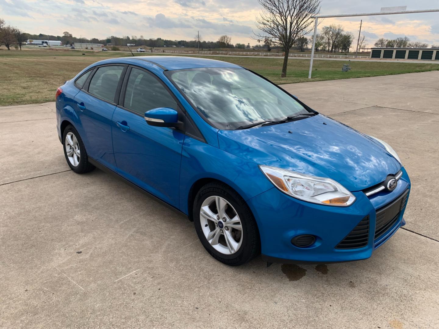 2014 BLUE Ford Focus SE Sedan (1FADP3F25EL) with an 2.0L L4 DOHC 16V engine, AUTOMATIC transmission, located at 17760 Hwy 62, Morris, OK, 74445, (918) 733-4887, 35.609104, -95.877060 - Photo#2