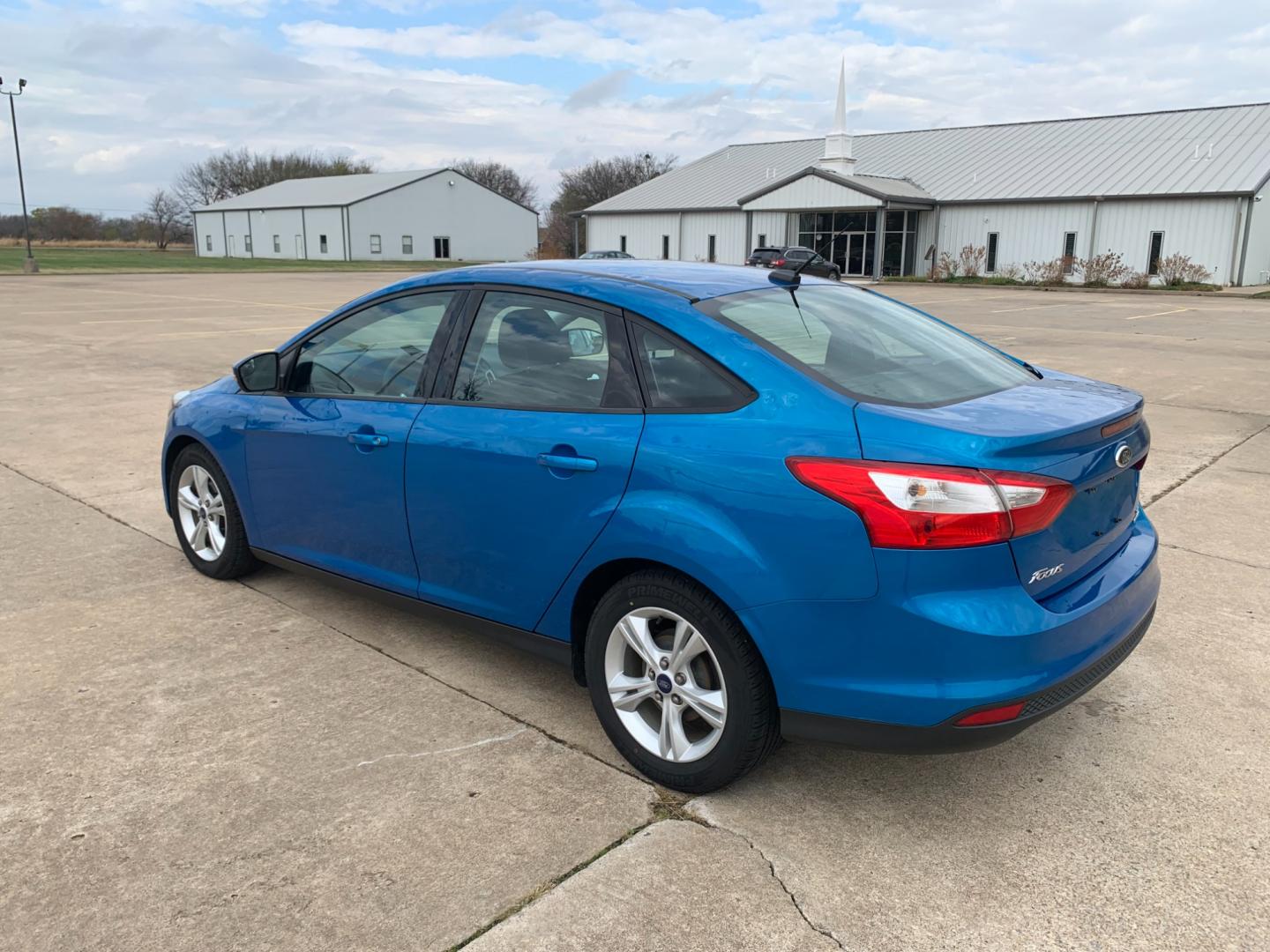 2014 BLUE Ford Focus SE Sedan (1FADP3F25EL) with an 2.0L L4 DOHC 16V engine, AUTOMATIC transmission, located at 17760 Hwy 62, Morris, OK, 74445, (918) 733-4887, 35.609104, -95.877060 - Photo#6