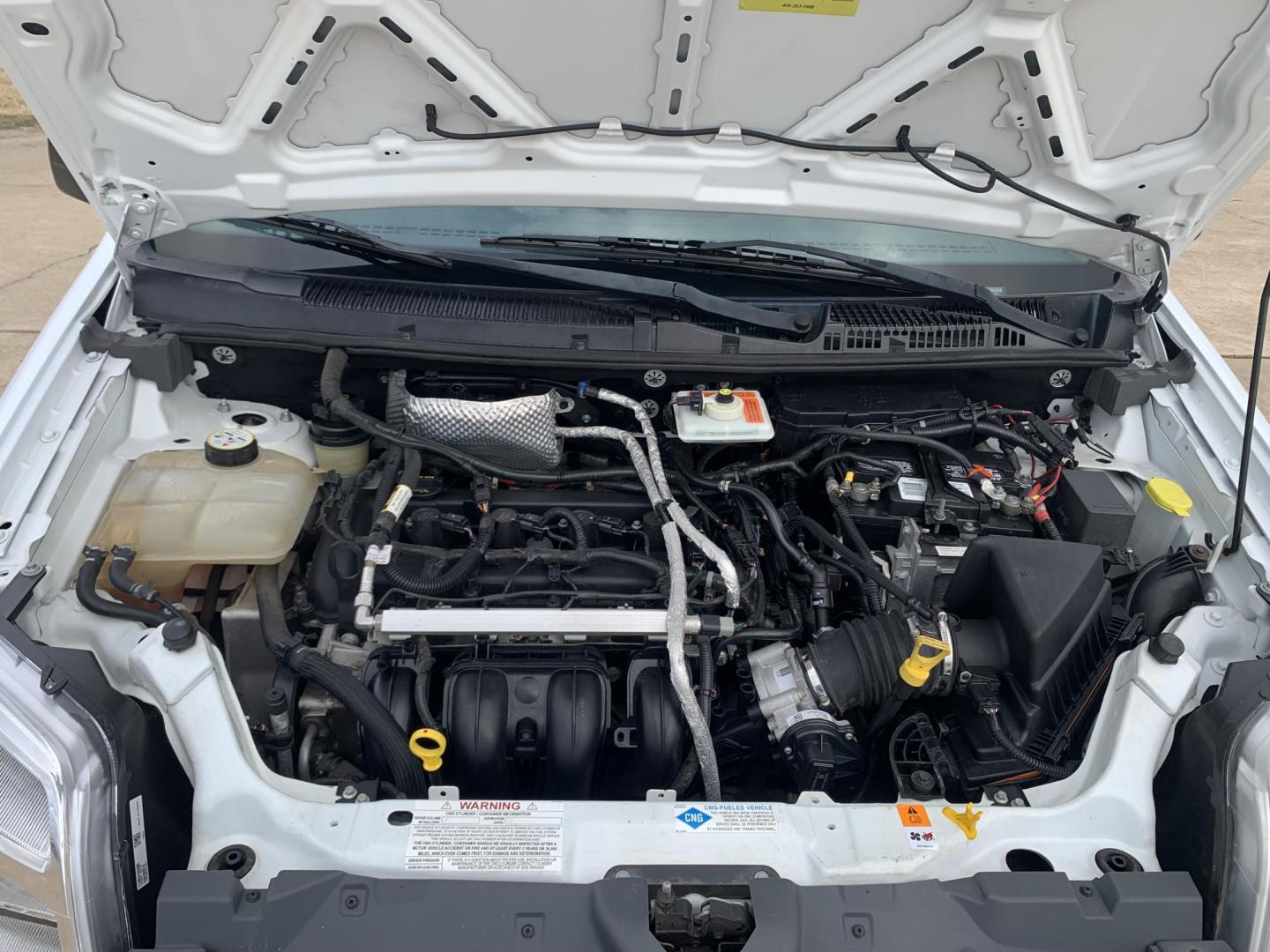 2013 White /Gray Ford Transit Connect XL (NM0LS7AN8DT) with an 2.0L L4 DOHC 16V engine, 4-Speed Automatic transmission, located at 17760 Hwy 62, Morris, OK, 74445, (918) 733-4887, 35.609104, -95.877060 - 2013 FORD TRANSIT CONNECT HAS A 2.0L AND FWD. THIS VAN IS A BI-FUEL THAT RUNS ON BOTH GASOLINE OR COMPRESSED NATURAL GAS (CNG). FEATURES, MANUEL WINDOWS, MANUAL MIRRORS, MANUAL SEATS, CLOTH INTERIOR, MANUAL LOCKS, BACKUP CAMERA, AND AM/FM STEREO. EQUIPPED WITH A BI-FUEL CNG FUEL SYSTEM. IT RUNS ON - Photo#14