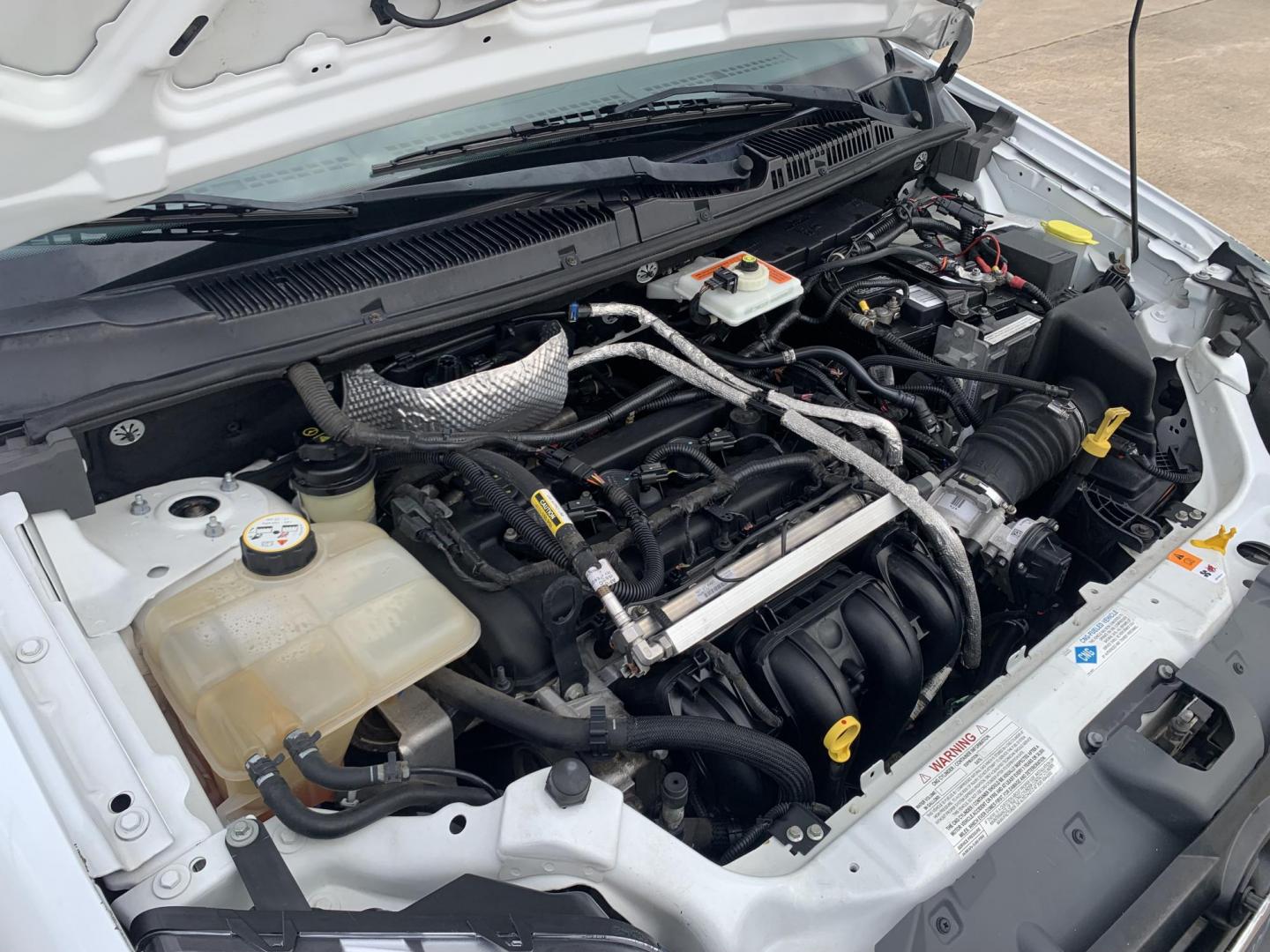 2013 White /Gray Ford Transit Connect XL (NM0LS7AN8DT) with an 2.0L L4 DOHC 16V engine, 4-Speed Automatic transmission, located at 17760 Hwy 62, Morris, OK, 74445, (918) 733-4887, 35.609104, -95.877060 - 2013 FORD TRANSIT CONNECT HAS A 2.0L AND FWD. THIS VAN IS A BI-FUEL THAT RUNS ON BOTH GASOLINE OR COMPRESSED NATURAL GAS (CNG). FEATURES, MANUEL WINDOWS, MANUAL MIRRORS, MANUAL SEATS, CLOTH INTERIOR, MANUAL LOCKS, BACKUP CAMERA, AND AM/FM STEREO. EQUIPPED WITH A BI-FUEL CNG FUEL SYSTEM. IT RUNS ON - Photo#16