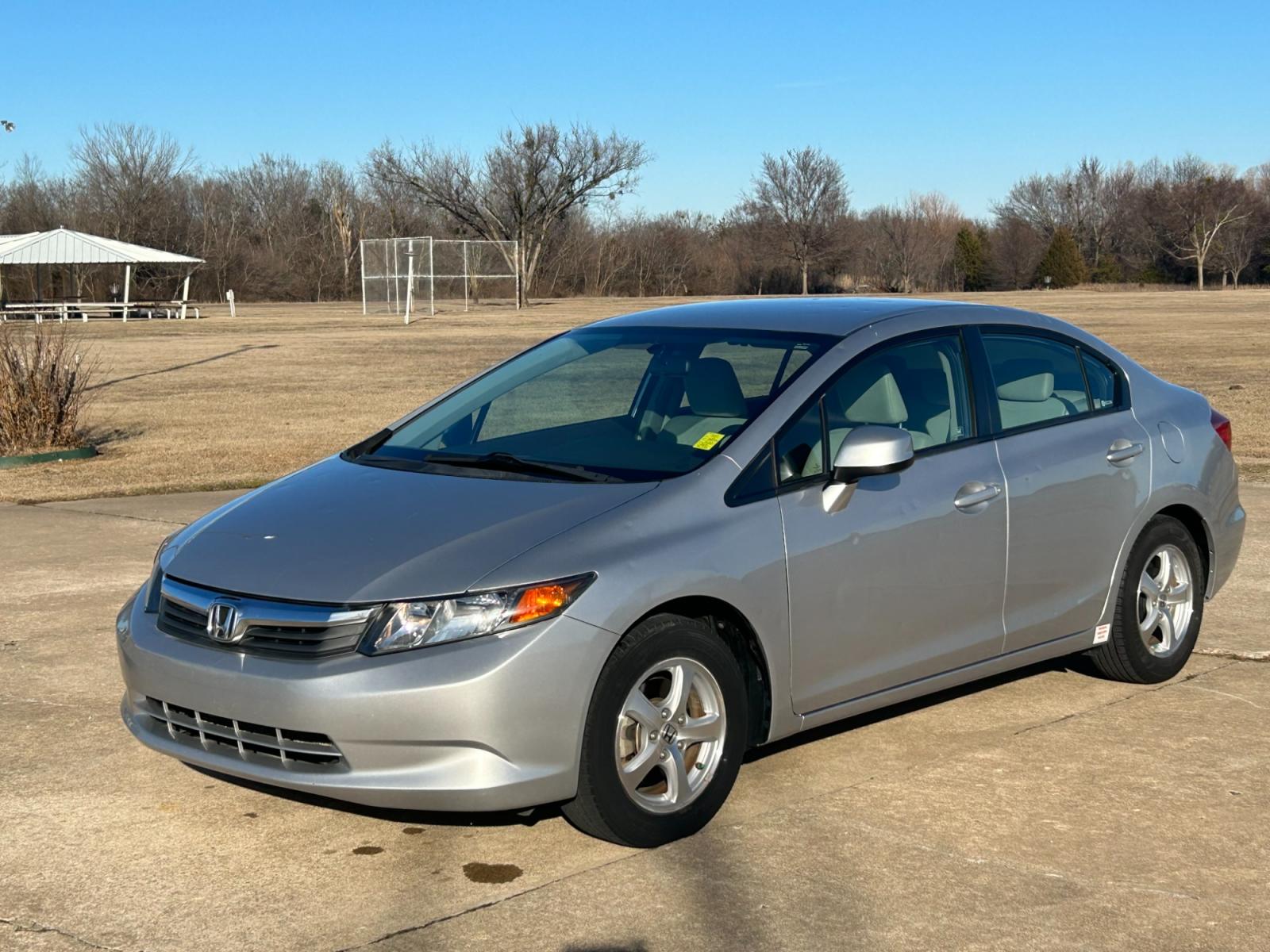 2012 Silver Honda Civic CNG Sedan 5-Speed AT (19XFB5F59CE) with an 1.8L L4 SOHC 16V CNG engine, 5-Speed Automatic transmission, located at 17760 Hwy 62, Morris, OK, 74445, (918) 733-4887, 35.609104, -95.877060 - 2012 HONDA CIVIC 1.8L FWD DEDICATED CNG (COMPRESSED NATURAL GAS) VEHICLE. FEATURES 2 KEYS, REMOTE KEYLESS ENTRY, POWER LOCKS, POWER WINDOWS, POWER MIRRORS, MANUEL SEATS, AM/FM RADIO, CD PLAYER, USB, AUX, BLUETOOTH FOR HANDS-FREE CALLING, 12V POWER OUTLET, CRUISE CONTROL, TRACTION CONTROL, CLOTH SEAT - Photo #1