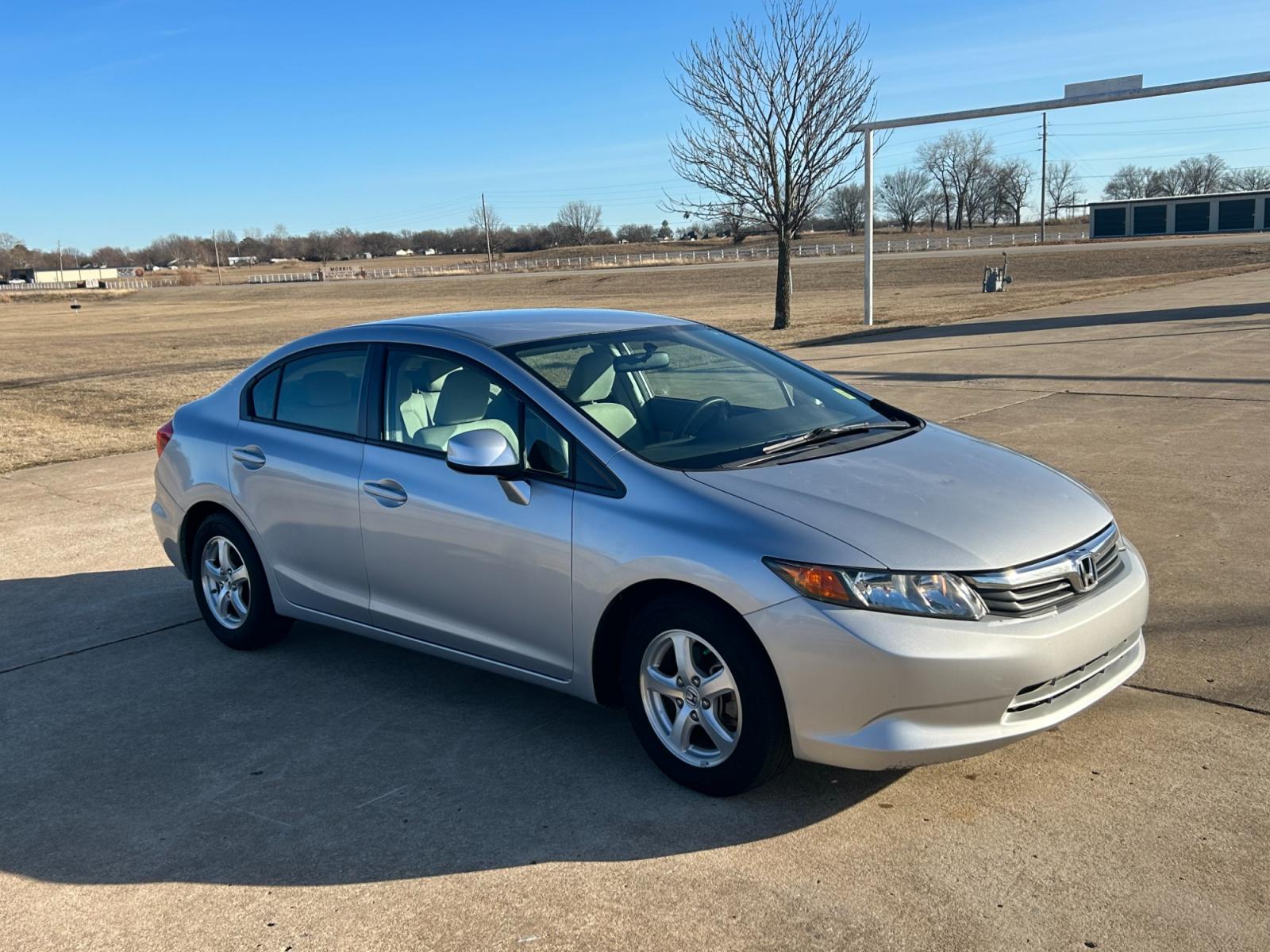 2012 Silver Honda Civic CNG Sedan 5-Speed AT (19XFB5F59CE) with an 1.8L L4 SOHC 16V CNG engine, 5-Speed Automatic transmission, located at 17760 Hwy 62, Morris, OK, 74445, (918) 733-4887, 35.609104, -95.877060 - 2012 HONDA CIVIC 1.8L FWD DEDICATED CNG (COMPRESSED NATURAL GAS) VEHICLE. FEATURES 2 KEYS, REMOTE KEYLESS ENTRY, POWER LOCKS, POWER WINDOWS, POWER MIRRORS, MANUEL SEATS, AM/FM RADIO, CD PLAYER, USB, AUX, BLUETOOTH FOR HANDS-FREE CALLING, 12V POWER OUTLET, CRUISE CONTROL, TRACTION CONTROL, CLOTH SEAT - Photo #2