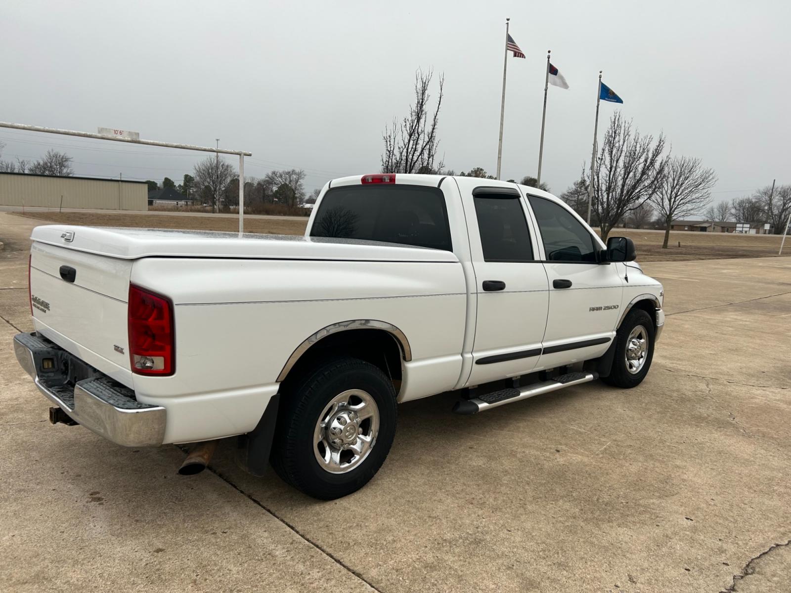 2004 White Dodge Ram 2500 Laramie Quad Cab 2WD (3D7KA28C94G) with an 5.9L L6 OHV 24V TURBO DIESEL engine, located at 17760 Hwy 62, Morris, OK, 74445, (918) 733-4887, 35.609104, -95.877060 - 2004 DODGE RAM HD 2500 HAS A 5.9L TURBO DIESEL AND IS RWD. IT FEATURES A KEYLESS ENTRY REMOTE, POWER LOCKS, POWER WINDOWS, POWER SEATS, POWER MIRRORS, AM/FM STEREO, CD PLAYER, CLOTH INTERIOR, DIGITAL COMPASS, CRUISE CONTROL, CENTURY BED COVER, AND TOW PACKAGE. 267/70R17 COOPER TIRES, 213,344 MILES. - Photo #5