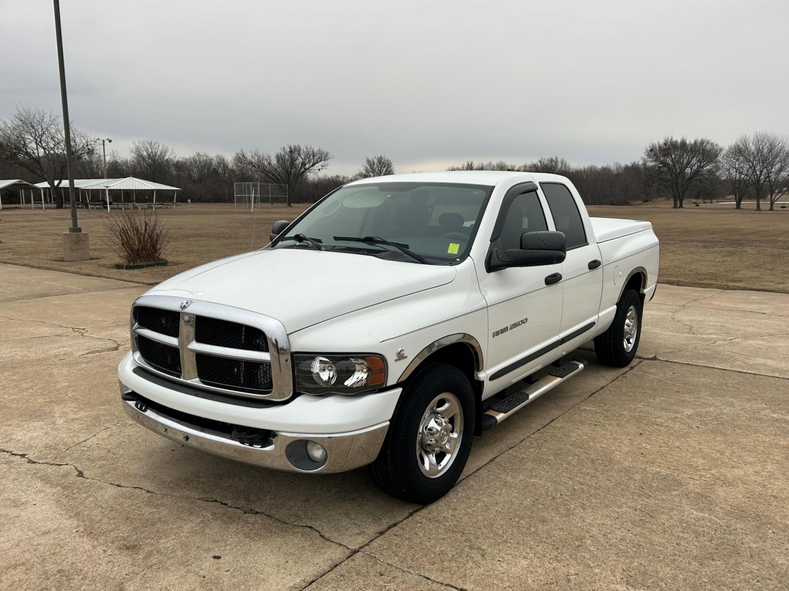 2004 White Dodge Ram 2500 Laramie Quad Cab 2WD (3D7KA28C94G) with an 5.9L L6 OHV 24V TURBO DIESEL engine, located at 17760 Hwy 62, Morris, OK, 74445, (918) 733-4887, 35.609104, -95.877060 - 2004 DODGE RAM HD 2500 HAS A 5.9L TURBO DIESEL AND IS RWD. IT FEATURES A KEYLESS ENTRY REMOTE, POWER LOCKS, POWER WINDOWS, POWER SEATS, POWER MIRRORS, AM/FM STEREO, CD PLAYER, CLOTH INTERIOR, DIGITAL COMPASS, CRUISE CONTROL, CENTURY BED COVER, AND TOW PACKAGE. 267/70R17 COOPER TIRES, 213,344 MILES. - Photo #1