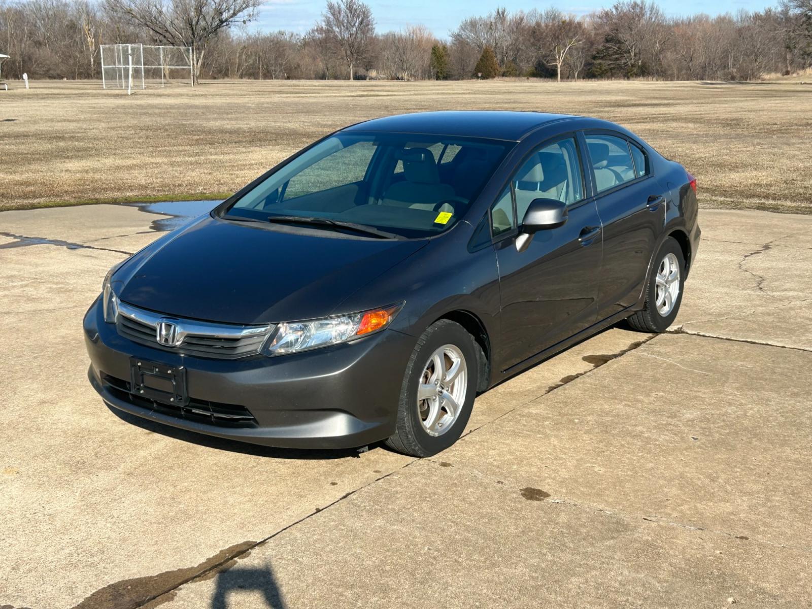 2012 Silver Honda Civic CNG Sedan 5-Speed AT (19XFB5F52CE) with an 1.8L L4 SOHC 16V CNG engine, 5-Speed Automatic transmission, located at 17760 Hwy 62, Morris, OK, 74445, (918) 733-4887, 35.609104, -95.877060 - 2012 HONDA CIVIC 1.8L FWD DEDICATED CNG (COMPRESSED NATURAL GAS) VEHICLE. 2012 HONDA CIVIC FEATURES 2 KEYS, REMOTE KEYLESS ENTRY, POWER LOCKS, POWER WINDOWS, POWER MIRRORS, MANUEL SEATS, TOUCHSCREEN RADIO, AM/FM RADIO, CD PLAYER, USB, AUX, BLUETOOTH FOR HANDS-FREE CALLING, NAVIGATION, 12V POWER OUTL - Photo #1
