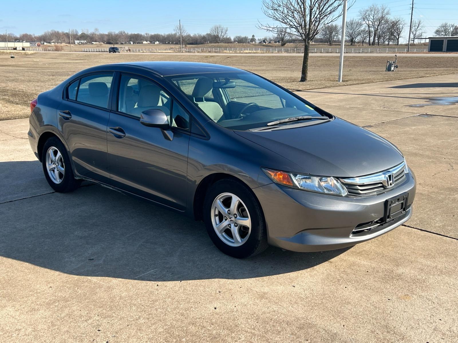 2012 Silver Honda Civic CNG Sedan 5-Speed AT (19XFB5F52CE) with an 1.8L L4 SOHC 16V CNG engine, 5-Speed Automatic transmission, located at 17760 Hwy 62, Morris, OK, 74445, (918) 733-4887, 35.609104, -95.877060 - 2012 HONDA CIVIC 1.8L FWD DEDICATED CNG (COMPRESSED NATURAL GAS) VEHICLE. 2012 HONDA CIVIC FEATURES 2 KEYS, REMOTE KEYLESS ENTRY, POWER LOCKS, POWER WINDOWS, POWER MIRRORS, MANUEL SEATS, TOUCHSCREEN RADIO, AM/FM RADIO, CD PLAYER, USB, AUX, BLUETOOTH FOR HANDS-FREE CALLING, NAVIGATION, 12V POWER OUTL - Photo #3