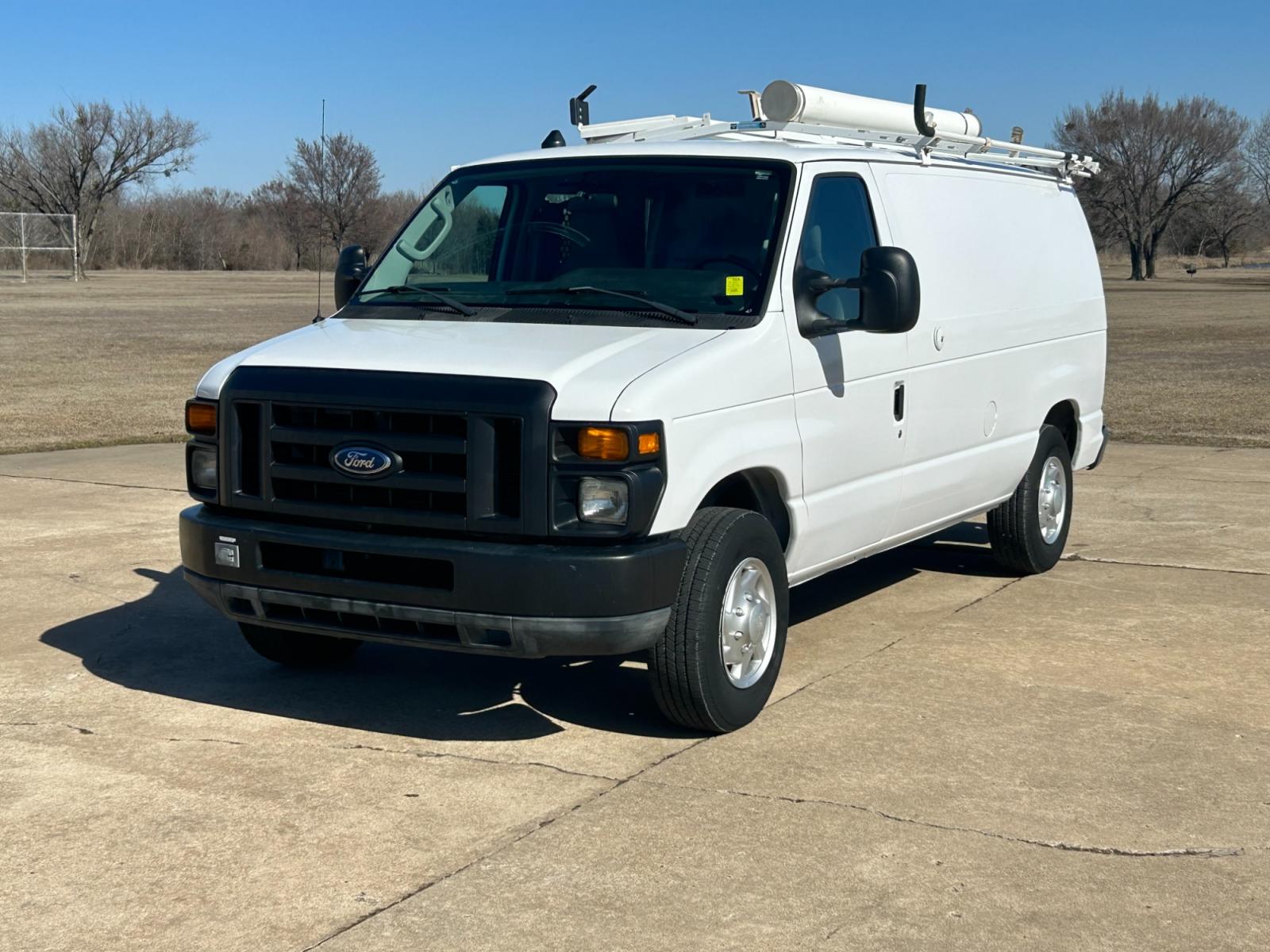 2011 White Ford E-Series Van E-250 (1FTNE2EL6BD) with an 5.4L V8 SOHC 16V engine, 4-Speed Automatic transmission, located at 17760 Hwy 62, Morris, OK, 74445, (918) 733-4887, 35.609104, -95.877060 - 2011 FORD E-SERIES VAN E-250 5.4 V8 DEDICATED CNG (COMPRESSED NATURAL GAS) DOES NOT RUN ON GASOLINE. THE FORD E-SERIES VAN FEATURES MANUAL SEATS, MANUAL LOCKS, MANUAL WINDOWS, MANUAL MIRRORS, FRONT HEAT AND AIR, AM/FM RADIO, LEATHER SEATS, STEEL SHELVES, SPLIT SWING-OUT RIGHT DOORS, AND PLENTY OF SP - Photo #1