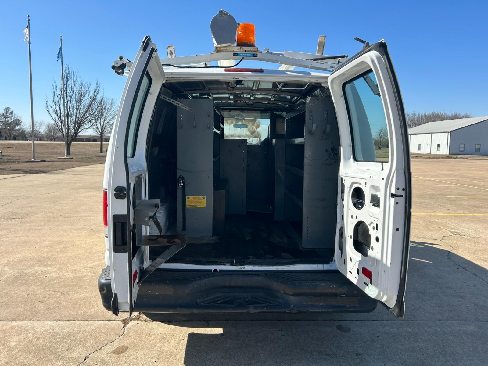 2011 White Ford E-Series Van E-250 (1FTNE2EL6BD) with an 5.4L V8 SOHC 16V engine, 4-Speed Automatic transmission, located at 17760 Hwy 62, Morris, OK, 74445, (918) 733-4887, 35.609104, -95.877060 - 2011 FORD E-SERIES VAN E-250 5.4 V8 DEDICATED CNG (COMPRESSED NATURAL GAS) DOES NOT RUN ON GASOLINE. THE FORD E-SERIES VAN FEATURES MANUAL SEATS, MANUAL LOCKS, MANUAL WINDOWS, MANUAL MIRRORS, FRONT HEAT AND AIR, AM/FM RADIO, LEATHER SEATS, STEEL SHELVES, SPLIT SWING-OUT RIGHT DOORS, AND PLENTY OF SP - Photo #14