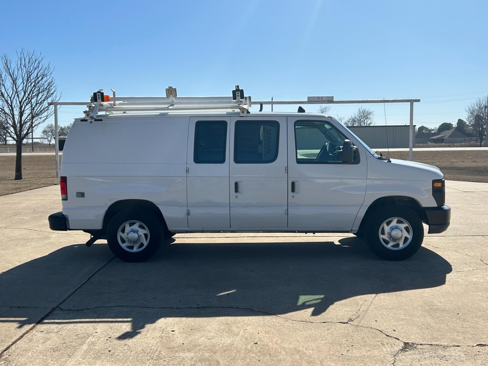 2011 White Ford E-Series Van E-250 (1FTNE2EL6BD) with an 5.4L V8 SOHC 16V engine, 4-Speed Automatic transmission, located at 17760 Hwy 62, Morris, OK, 74445, (918) 733-4887, 35.609104, -95.877060 - 2011 FORD E-SERIES VAN E-250 5.4 V8 DEDICATED CNG (COMPRESSED NATURAL GAS) DOES NOT RUN ON GASOLINE. THE FORD E-SERIES VAN FEATURES MANUAL SEATS, MANUAL LOCKS, MANUAL WINDOWS, MANUAL MIRRORS, FRONT HEAT AND AIR, AM/FM RADIO, LEATHER SEATS, STEEL SHELVES, SPLIT SWING-OUT RIGHT DOORS, AND PLENTY OF SP - Photo #4