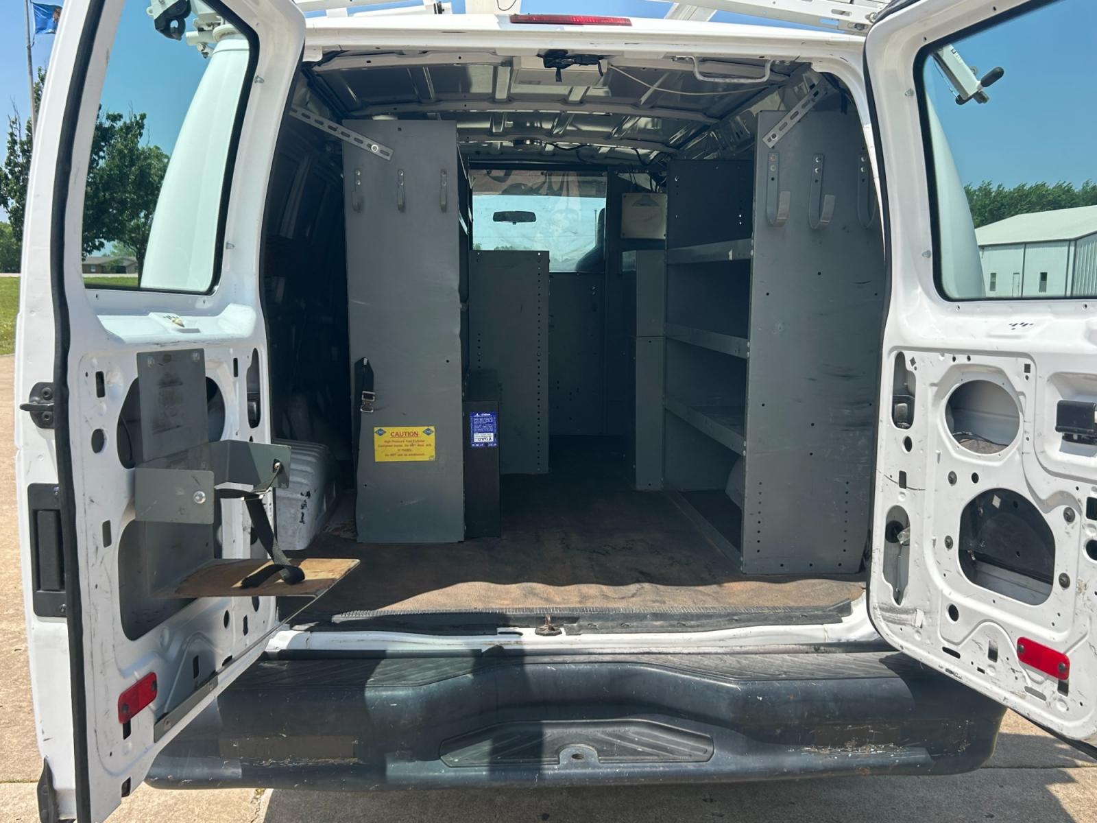 2011 White Ford E-Series Van E-250 (1FTNE2EL5BD) with an 5.4L V8 SOHC 16V engine, 4-Speed Automatic transmission, located at 17760 Hwy 62, Morris, OK, 74445, (918) 733-4887, 35.609104, -95.877060 - 2011 FORD E-SERIES VAN E-250 5.4 V8 DEDICATED CNG (COMPRESSED NATURAL GAS) DOES NOT RUN ON GASOLINE. THE FORD E-SERIES VAN FEATURES MANUAL SEATS, MANUAL LOCKS, MANUAL WINDOWS, MANUAL MIRRORS, FRONT HEAT AND AIR, AM/FM RADIO, LEATHER SEATS, STEEL SHELVES, SPLIT SWING-OUT RIGHT DOORS, AND PLENTY OF SP - Photo #17