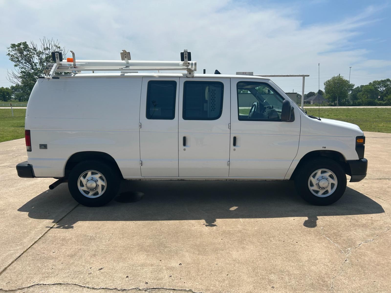 2011 White Ford E-Series Van E-250 (1FTNE2EL5BD) with an 5.4L V8 SOHC 16V engine, 4-Speed Automatic transmission, located at 17760 Hwy 62, Morris, OK, 74445, (918) 733-4887, 35.609104, -95.877060 - 2011 FORD E-SERIES VAN E-250 5.4 V8 DEDICATED CNG (COMPRESSED NATURAL GAS) DOES NOT RUN ON GASOLINE. THE FORD E-SERIES VAN FEATURES MANUAL SEATS, MANUAL LOCKS, MANUAL WINDOWS, MANUAL MIRRORS, FRONT HEAT AND AIR, AM/FM RADIO, LEATHER SEATS, STEEL SHELVES, SPLIT SWING-OUT RIGHT DOORS, AND PLENTY OF SP - Photo #4