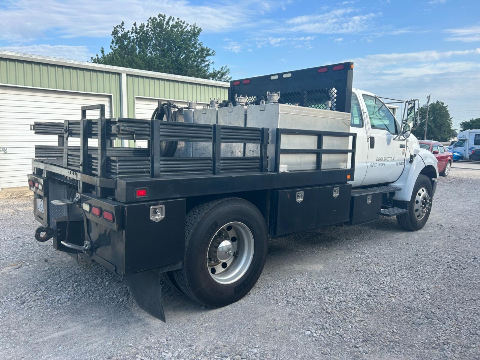 2008 White Ford F-750 SuperCab 2WD DRW (3FRXX75G68V) with an 7.2L L6 DIESEL engine, AUTOMATIC transmission, located at 17760 Hwy 62, Morris, OK, 74445, (918) 733-4887, 35.609104, -95.877060 - 2008 FORD F-750 HAS THE 7.2L ENGINE. THIS TRUCK RUNS ON DIESEL ONLY. FEATURES POWER LOCKS, POWER WINDOWS, MANUAL SEATS, AM/FM STEREO, CD PLAYER, LEATHER SEATS, CUSTOM BED, WITH LOTS OF STORAGE 233,874 MILES WITH A CLEAN TITLE AND FREE CARFAX REPORT $29,500 CALL RUSS OR JONA AT 918-733-4887 - Photo #3