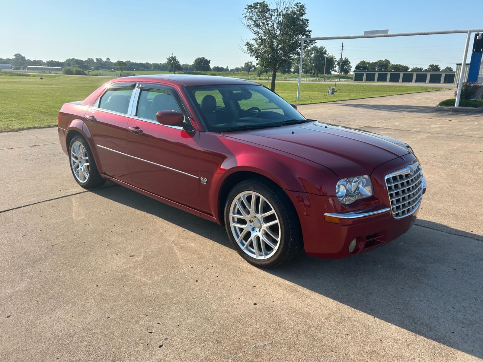 2007 RED Chrysler 300 C (2C3KA63H07H) with an 5.7L V8 OHV 16V engine, 5-Speed Automatic Overdrive transmission, located at 17760 Hwy 62, Morris, OK, 74445, (918) 733-4887, 35.609104, -95.877060 - 2007 CHRYSLER 300 C HAS A 5.7L V8 OHV 16V WITH RWD. FEATURES POWER SEATS, POWER LOCKS, POWER WINDOWS, POWER MIRRORS, AM/FM STEREO, CD PLAYER, CASSETTE PLAYER, HEATED SEATS, LEATHER SEATS, DUAL CLIMATE CONTROL, MULTIFUNCTION STEERING WHEEL CONTROLS, SUNROOF, FREE CARFAX REPORT. 170,490 MILES WITH 245 - Photo #3