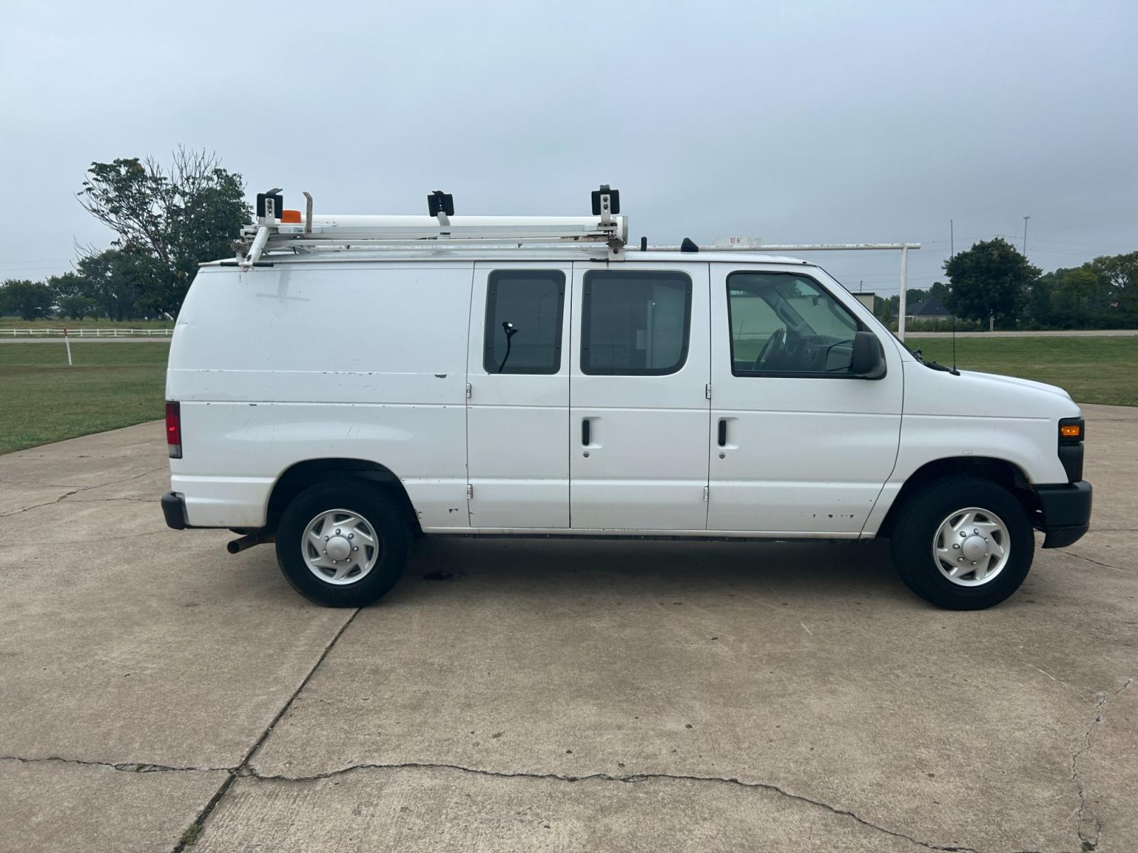 2010 White Ford E-Series Van E-250 (1FTNE2EL9AD) with an 5.4L V8 SOHC 16V engine, 4-Speed Automatic transmission, located at 17760 Hwy 62, Morris, OK, 74445, (918) 733-4887, 35.609104, -95.877060 - 2010 FORD E-SERIES VAN E-250 5.4 V8 DEDICATED CNG (COMPRESSED NATURAL GAS) DOES NOT RUN ON GASOLINE. FEATURES MANUAL SEATS, MANUAL LOCKS, MANUAL WINDOWS, MANUAL MIRRORS, AM/FM STEREO, 1500 WATT INVERTER. IT IS EQUIPPED WITH A CNG FUELING SYSTEM, IT RUNS ON COMPRESSED NATURAL GAS. A PREMIER ALTERNATI - Photo #4