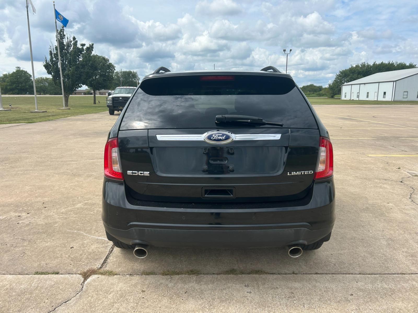 2013 BLACK Ford Edge Limited FWD (2FMDK3KC9DB) with an 3.5L V6 DOHC 24V engine, 6-Speed Automatic transmission, located at 17760 Hwy 62, Morris, OK, 74445, (918) 733-4887, 35.609104, -95.877060 - 2013 FORD EDGE LIMITED FWD 3.5L V6 FEATURES POWER SEATS, POWER WINDOWS, POWER MIRRORS, POWER LOCKS, TOUCHSCREEN RADIO, AM/FM STEREO, CD PLAYER, HEATED SEATS, LEATHER SEATS, DUAL CLIMATE CONTROL, MULTI-FUNCTION STEERING WHEEL CONTROLS, CRUISE CONTROL, HANDS-FREE CALLING, BACK-UP CAMERA. 54,502 MILES - Photo #5