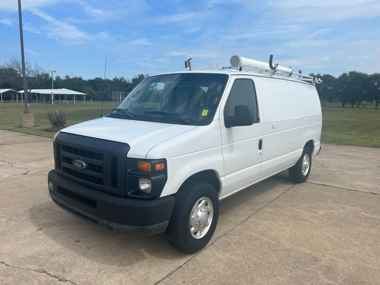 2010 White Ford E-Series Van E-250 (1FTNE2ELXAD) with an 5.4L V8 SOHC 16V engine, 4-Speed Automatic transmission, located at 17760 Hwy 62, Morris, OK, 74445, (918) 733-4887, 35.609104, -95.877060 - Photo #0