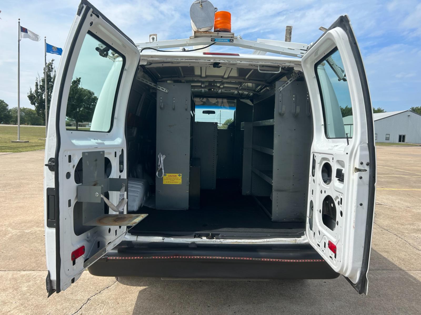 2010 White Ford E-Series Van E-250 (1FTNE2ELXAD) with an 5.4L V8 SOHC 16V engine, 4-Speed Automatic transmission, located at 17760 Hwy 62, Morris, OK, 74445, (918) 733-4887, 35.609104, -95.877060 - Photo #13