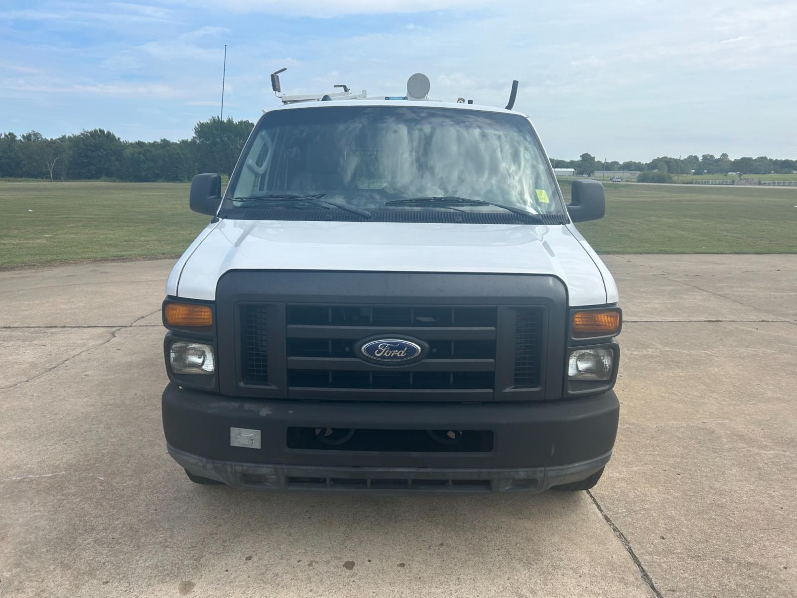 2010 White Ford E-Series Van E-250 (1FTNE2ELXAD) with an 5.4L V8 SOHC 16V engine, 4-Speed Automatic transmission, located at 17760 Hwy 62, Morris, OK, 74445, (918) 733-4887, 35.609104, -95.877060 - Photo #1