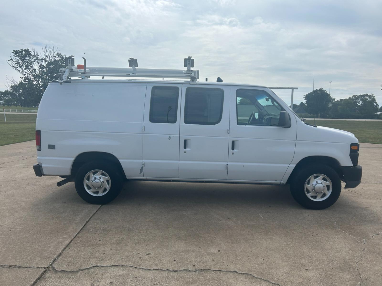 2010 White Ford E-Series Van E-250 (1FTNE2ELXAD) with an 5.4L V8 SOHC 16V engine, 4-Speed Automatic transmission, located at 17760 Hwy 62, Morris, OK, 74445, (918) 733-4887, 35.609104, -95.877060 - Photo #3