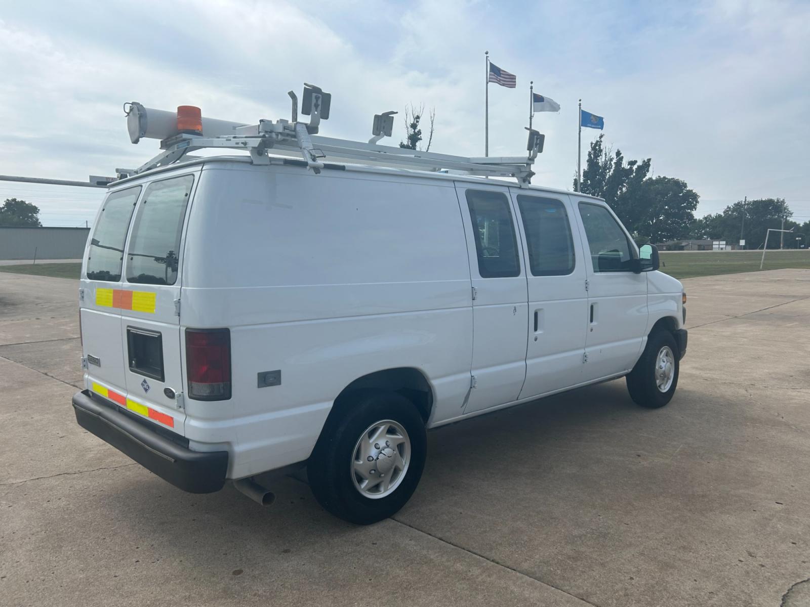 2010 White Ford E-Series Van E-250 (1FTNE2ELXAD) with an 5.4L V8 SOHC 16V engine, 4-Speed Automatic transmission, located at 17760 Hwy 62, Morris, OK, 74445, (918) 733-4887, 35.609104, -95.877060 - Photo #4