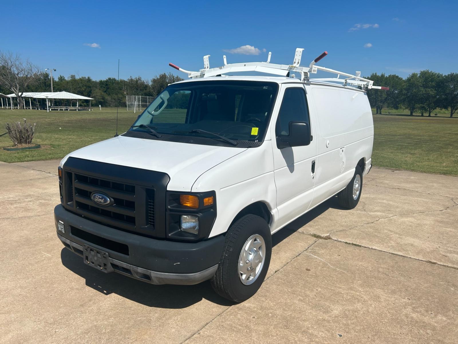 2010 White Ford E-Series Van E-250 (1FTNE2EL9AD) with an 5.4L V8 SOHC 16V engine, 4-Speed Automatic transmission, located at 17760 Hwy 62, Morris, OK, 74445, (918) 733-4887, 35.609104, -95.877060 - Photo #1