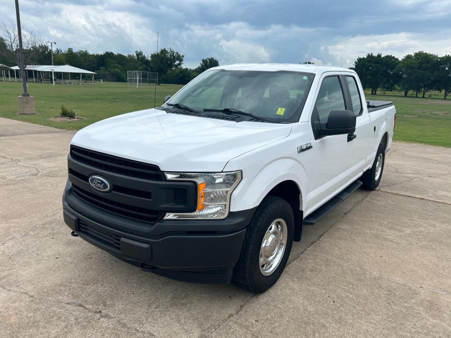 2018 White /Gray Ford F-150 EXTENDED CAB (1FTFX1E53JK) with an 5.0L V8 OHV 16V engine, AUTOMATIC transmission, located at 17760 Hwy 62, Morris, OK, 74445, (918) 733-4887, 35.609104, -95.877060 - 2018 FORD F150 HAS A 5.0L V8 ENGINE AND IS 4WD. FEATURES KEYLESS ENTERY, LEATHER INTERIOR, POWER WINDOWS, POWER LOCKS, POWER MIRRORS, AM/FM RADIO, A/C, TRACTION CONTROL, AUXILIARY PORT, BACKUP CAMERA, TILT STEERING WHEEL, BED COVER, AND BED LINER. EQUIPPED WITH A BI-FUEL CNG FUEL SYSTEM. IT RUNS ON - Photo#0