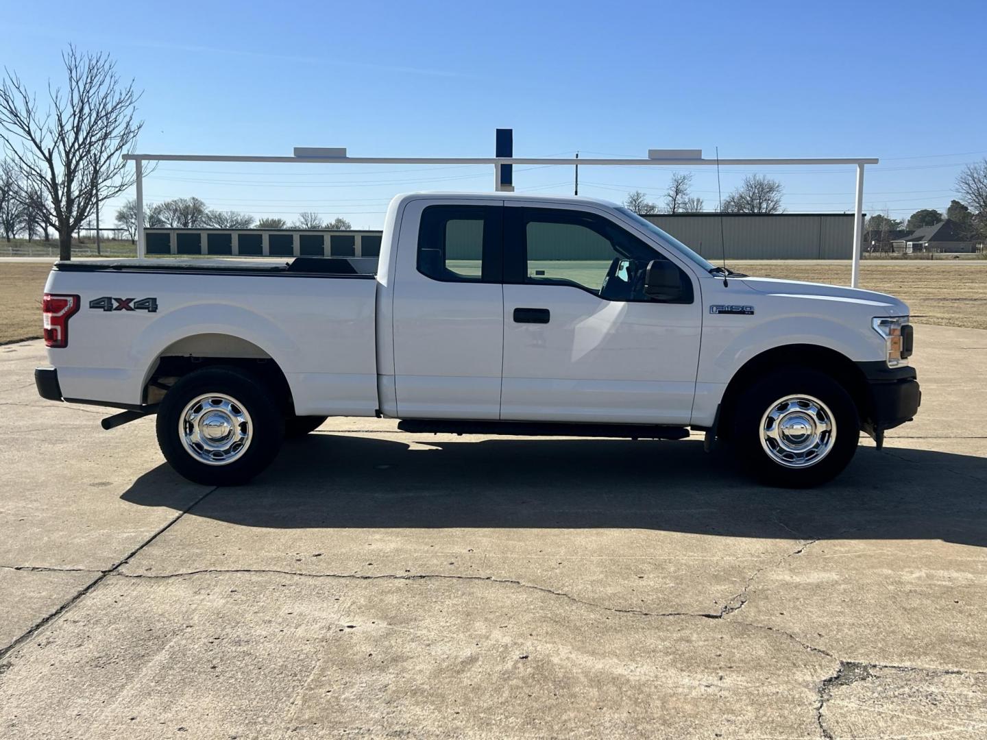 2018 White /Gray Ford F-150 EXTENDED CAB (1FTFX1E52JK) with an 5.0L V8 OHV 16V engine, 10 SPEED AUTOMATIC transmission, located at 17760 Hwy 62, Morris, OK, 74445, (918) 733-4887, 35.609104, -95.877060 - 2018 FORD F150 HAS A 5.0L V8 ENGINE AND IS 4WD. FEATURES KEYLESS ENTERY, LEATHER INTERIOR, POWER WINDOWS, POWER LOCKS, POWER MIRRORS, AM/FM RADIO, A/C, TRACTION CONTROL, AUXILIARY PORT, BACKUP CAMERA, TILT STEERING WHEEL, BED COVER, AND BED LINER. EQUIPPED WITH A BI-FUEL CNG FUEL SYSTEM. IT RUNS ON - Photo#3