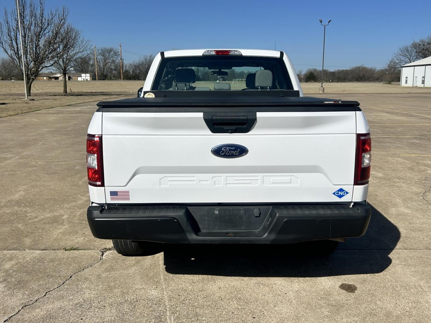 2018 White /Gray Ford F-150 EXTENDED CAB (1FTFX1E52JK) with an 5.0L V8 OHV 16V engine, 10 SPEED AUTOMATIC transmission, located at 17760 Hwy 62, Morris, OK, 74445, (918) 733-4887, 35.609104, -95.877060 - 2018 FORD F150 HAS A 5.0L V8 ENGINE AND IS 4WD. FEATURES KEYLESS ENTERY, LEATHER INTERIOR, POWER WINDOWS, POWER LOCKS, POWER MIRRORS, AM/FM RADIO, A/C, TRACTION CONTROL, AUXILIARY PORT, BACKUP CAMERA, TILT STEERING WHEEL, BED COVER, AND BED LINER. EQUIPPED WITH A BI-FUEL CNG FUEL SYSTEM. IT RUNS ON - Photo#5