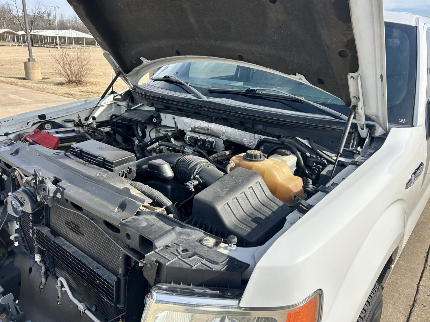 2012 White /Gray Ford F-150 XL SuperCab Bed 4WD (1FTVX1EF3CK) with an 5.0L V8 OHV 16V engine, 6-Speed Automatic transmission, located at 17760 Hwy 62, Morris, OK, 74445, (918) 733-4887, 35.609104, -95.877060 - 2012 FORD F-150 BI-FUEL SYSTEM RUNS ON CNG OR GASOLINE HAS THE 5.0L V8 AND IS 4WD. FEATURES POWER LOCKS, POWER WINDOWS, POWER MIRRORS, TOUCH SCREEN AM/FM STEREO, BLUETOOTH STEREO, CLOTH INTERIOR, BED LINER, CRUISE CONTROL, TRACTION CONTROL, TRAILER BRAKES, MULTI-FUNCTION STEERING CONTROL. A PREMIER - Photo#22