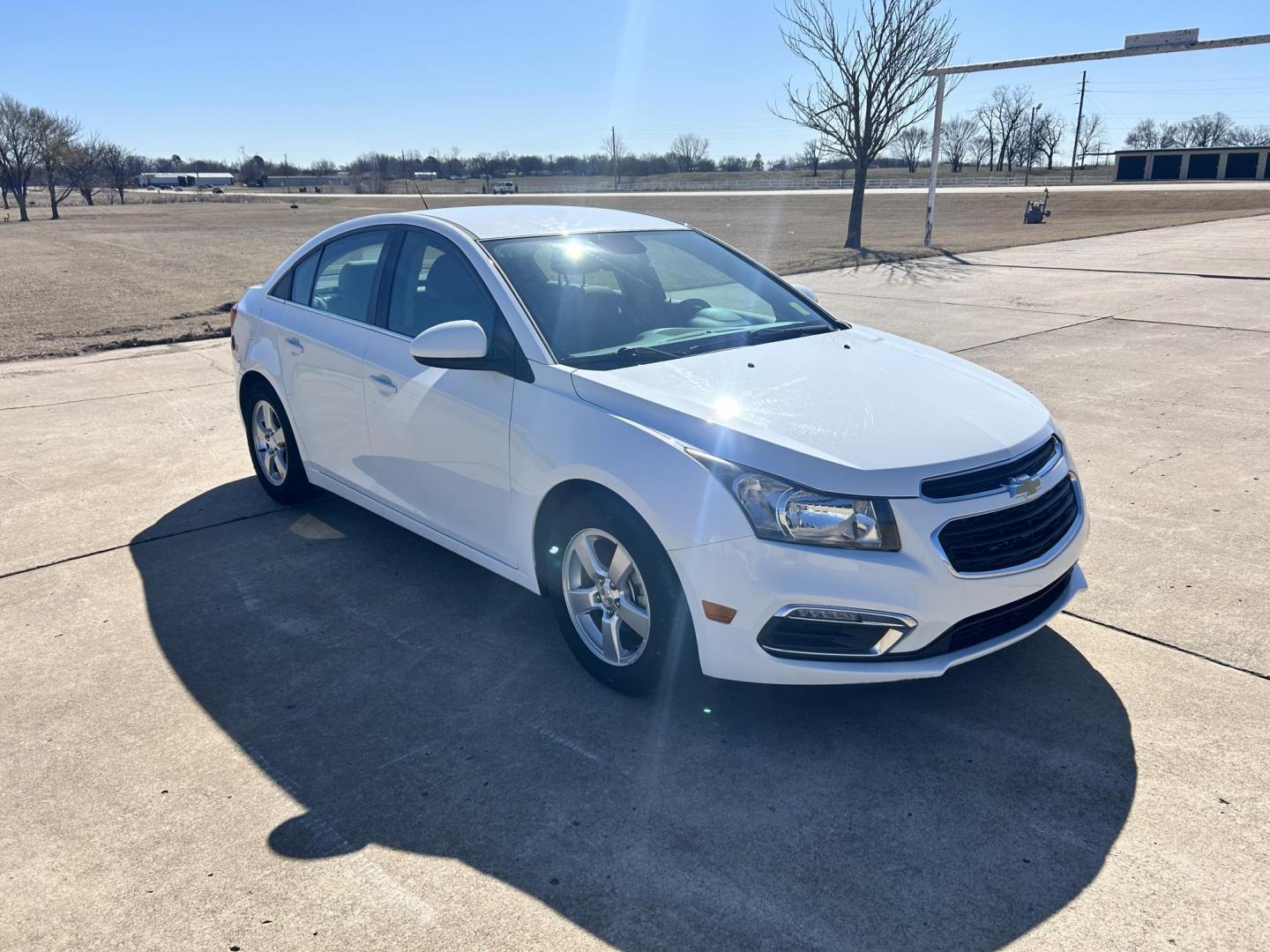 2015 White /Gray Chevrolet Cruze 1LT Auto (1G1PC5SB9F7) with an 1.4L L4 DOHC 16V TURBO engine, 6-Speed Automatic transmission, located at 17760 Hwy 62, Morris, OK, 74445, (918) 733-4887, 35.609104, -95.877060 - 2015 CHEVROLET CRUZE 1.4L L4 DOHC 16V TURBO FFV FWD, A BI-FUEL SYSTEM THAT RUNS ON CNG (COMPRESSED NATURAL GAS) OR GASOLINE. GREAT FOR YOUR EVERYDAY COMMUTE 42 MPG!!!!! THE CHEVROLET CRUZE FEATURES POWER LOCKS, POWER WINDOWS, POWER MIRRORS, MANUAL SEATS, CLOTH SEATS, AM/FM RADIO, CD PLAYER, ON STAR - Photo#0