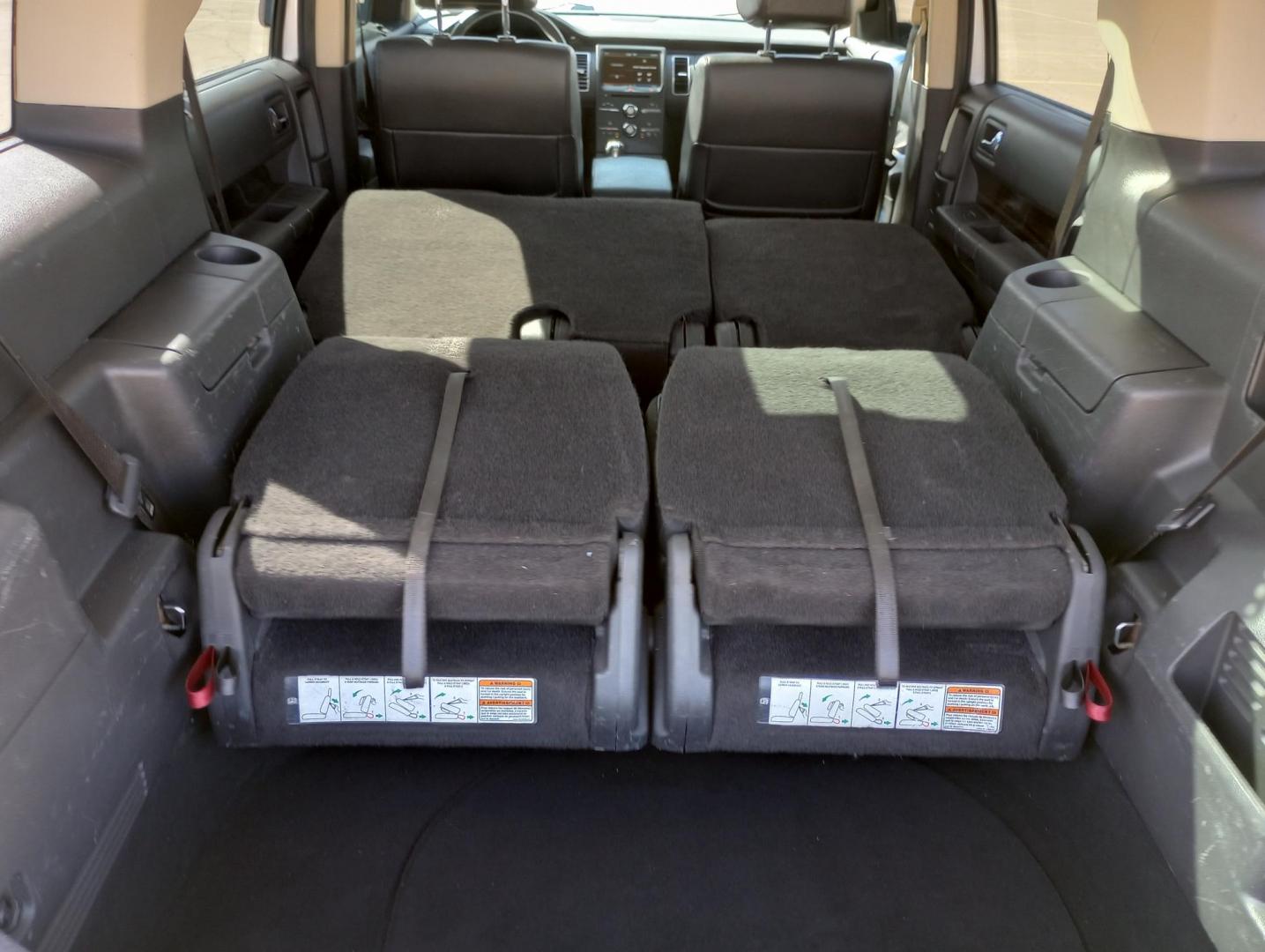 2014 Silver /BLACK Ford Flex SEL FWD (2FMGK5C87EB) with an 3.5L V6 DOHC 24V engine, 6-Speed Automatic Overdrive transmission, located at 17760 Hwy 62, Morris, OK, 74445, (918) 733-4887, 35.609104, -95.877060 - 2014 FORD FLEX 3.5L V6 DOHC 24V FEATURES POWER LOCKS, POWER WINDOWS, POWER MIRRORS, DUAL CLIMATE CONTROL, REAR CLIMATE CONTROL, LEATHER SEATS, CRUISE CONTROL, MULTI-FUNCTION STEERING WHEEL CONTROL, NAVIGATION SYSTEM, AM/FM STEREO, XM STEREO, CD PLAYER, BLUETOOTH, TOUCHSCREEN RADIO, BACK-UP CAMERA, 3 - Photo#28