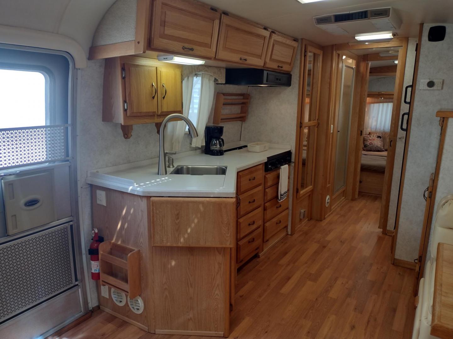 2003 Silver /TAN AIRSTREAM M30 LIMITED M30 LIMITED (1STJBBP213J) , located at 17760 Hwy 62, Morris, OK, 74445, 35.609104, -95.877060 - GRAB IT WHILE YOU CAN!!! 2003 AIRSTREAM CLASSIC LIMITED M30 WITH SLIDE OUT OVERALL 31FT. IN THE LIVING/KITCHEN AREA IS LEATHER SOFA THAT FOLDS DOWN FOR ADDITIONAL SLEEPING, STORAGE DRAWER UNDER SOFA, HAS A SIDE TABLE, OVERHEAD STORAGE CABINETS, LEATHER BOOTH STYLE DINETTE THAT FOLDS DOWN FOR ADDITIO - Photo#13
